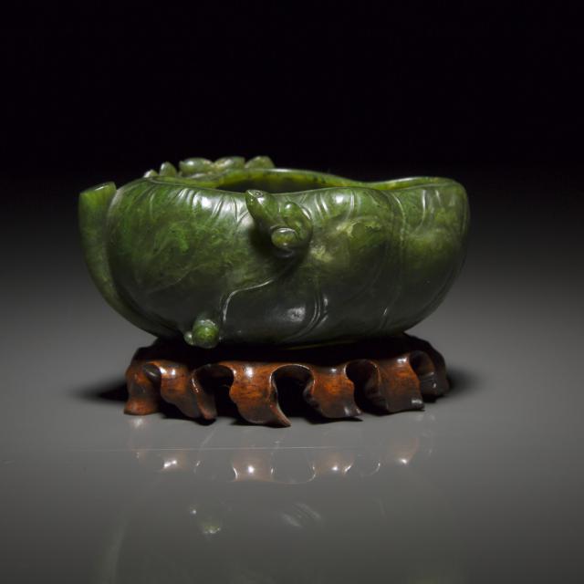 A Carved Spinach-Green Jade 'Lotus' Brush Washer, Qing Dynasty, 19th Century