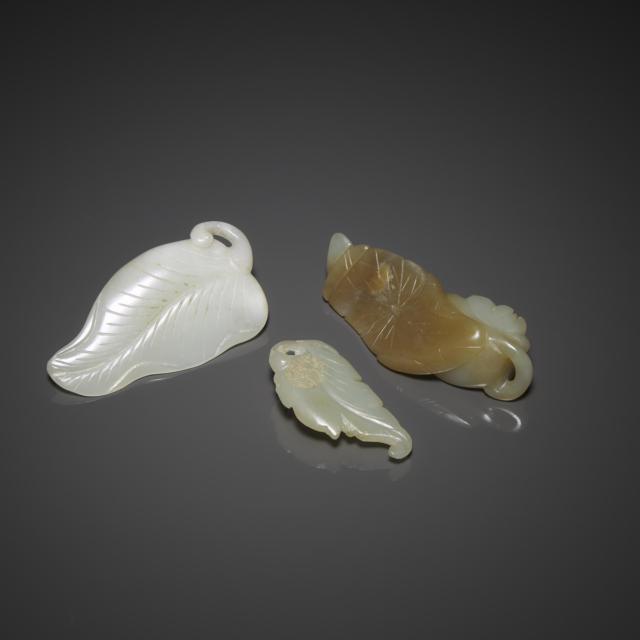 A Group of Three White and Pale Celadon Jade Pendants, Ming/Qing Dynasty