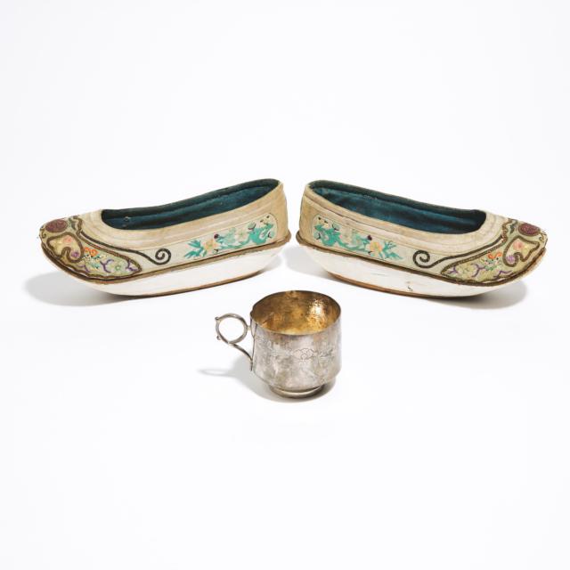 A Pair of Chinese Silk Embroidered Ladies' Shoes, together with a Silver Tea Cup, Late Qing Dynasty