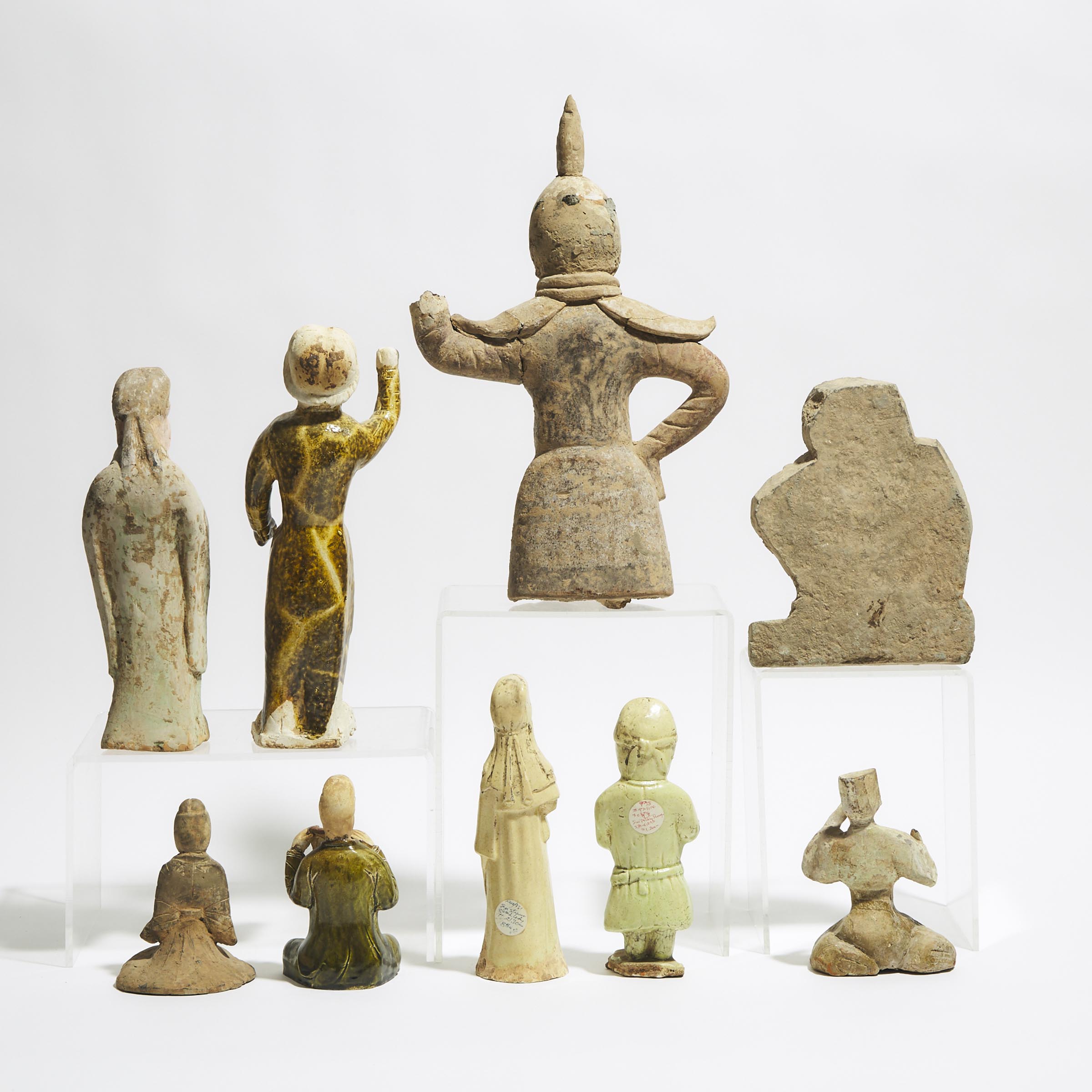 A Group of Nine Pottery Tomb Figures, Han/Tang Dynasty