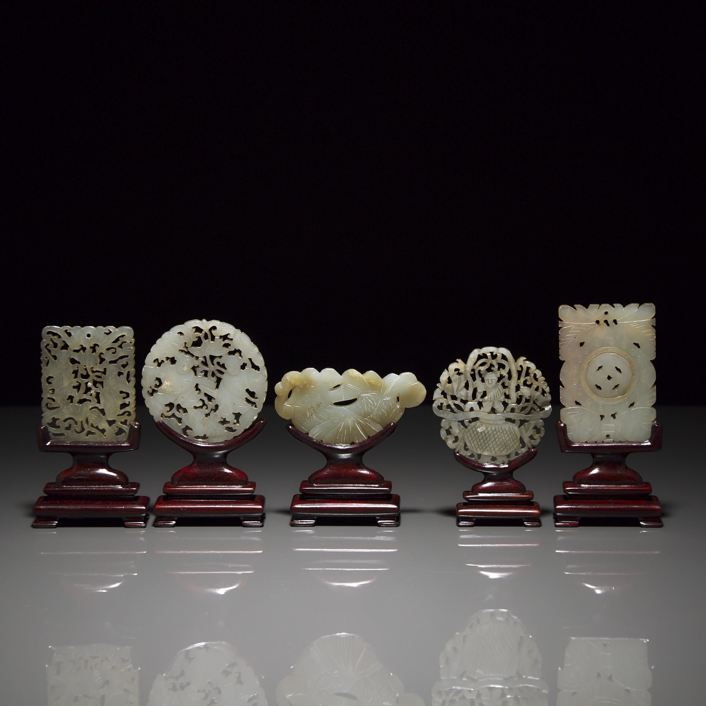 A Group of Five Carved Jade Plaques on Stands, Ming Dynasty and Later