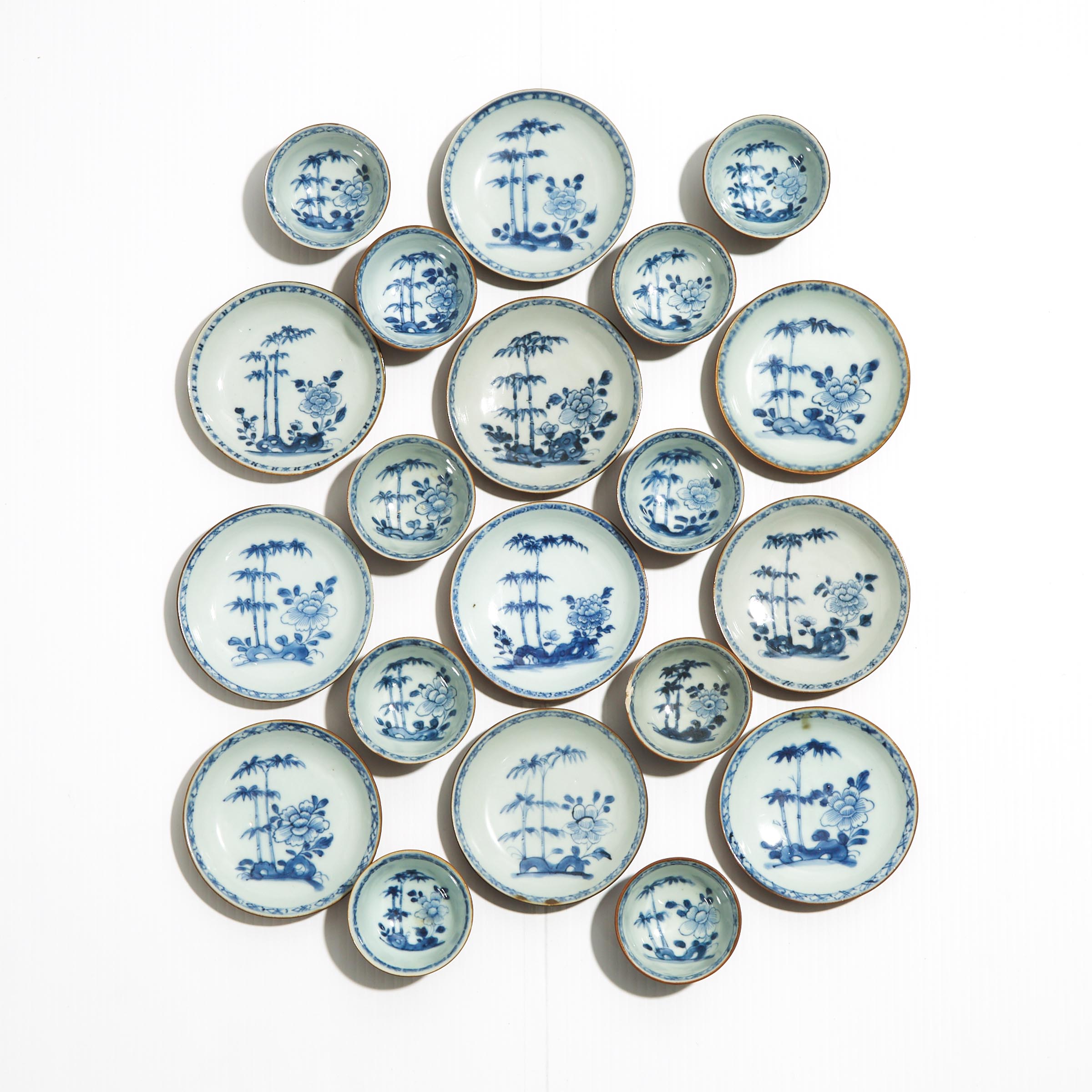 A Set of Twenty 'Batavian Bamboo and Peony' Pattern Teabowls and Saucers from the Nanking Cargo, Qianlong Period, Circa 1750