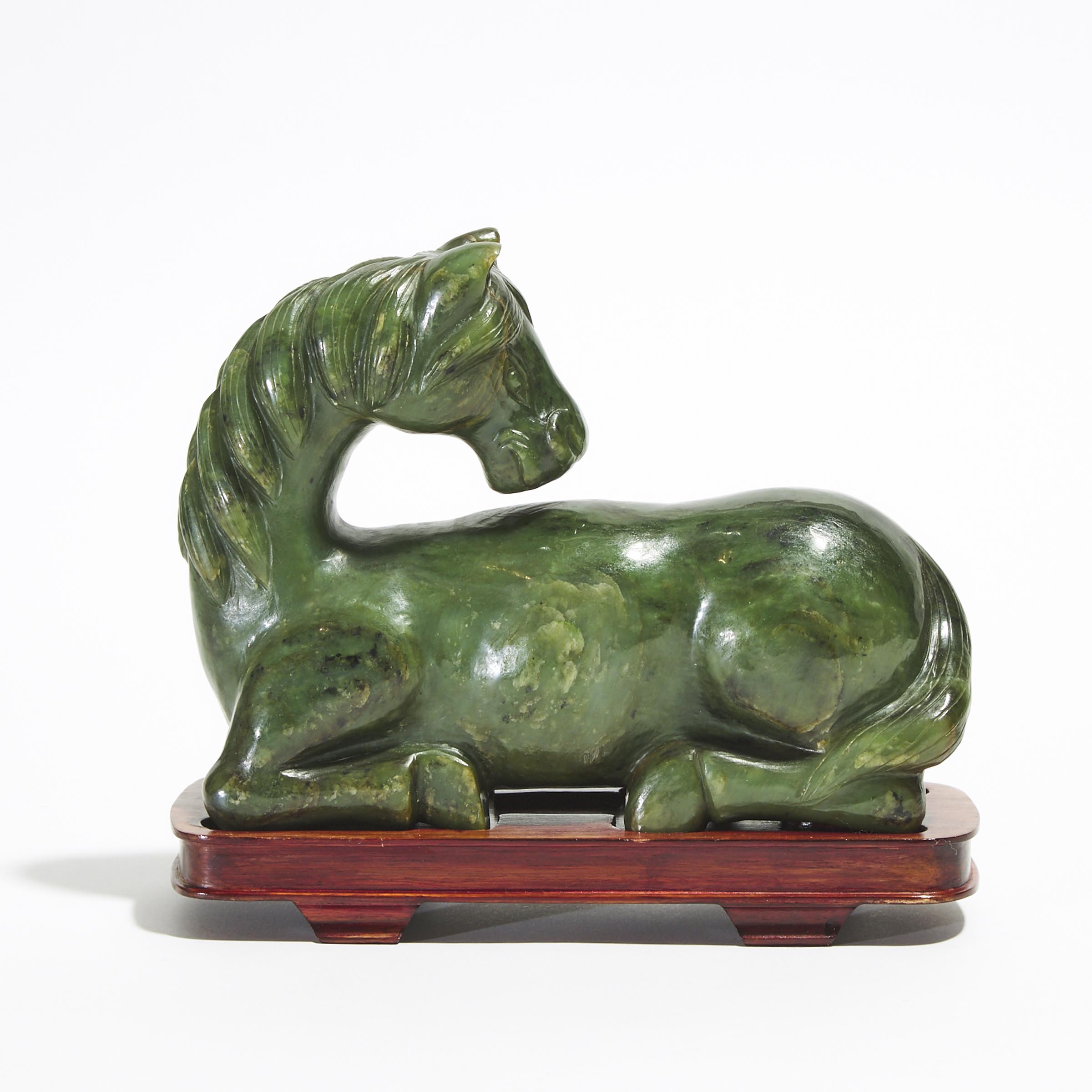 A Spinach Jade Carving of a Recumbent Horse 