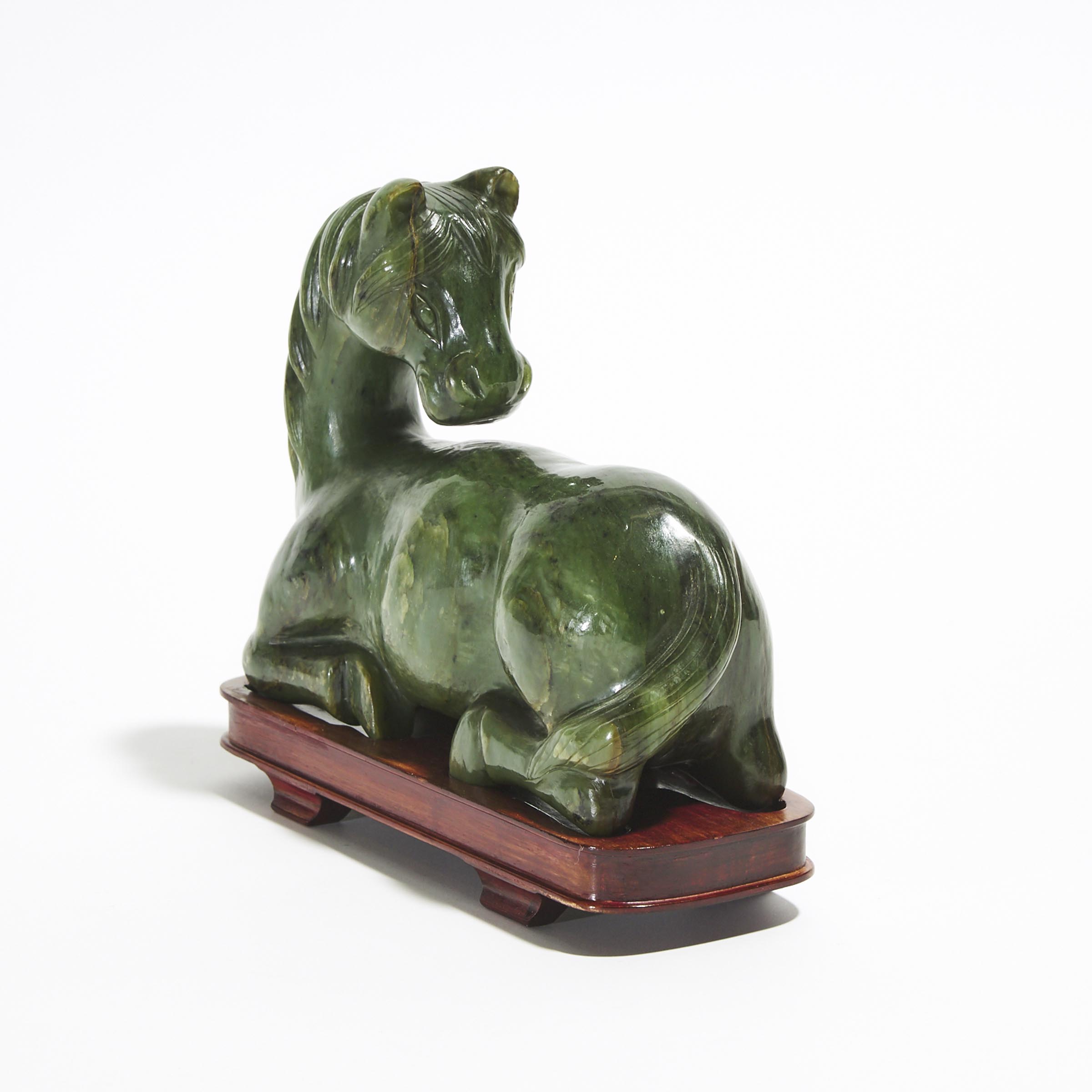 A Spinach Jade Carving of a Recumbent Horse 