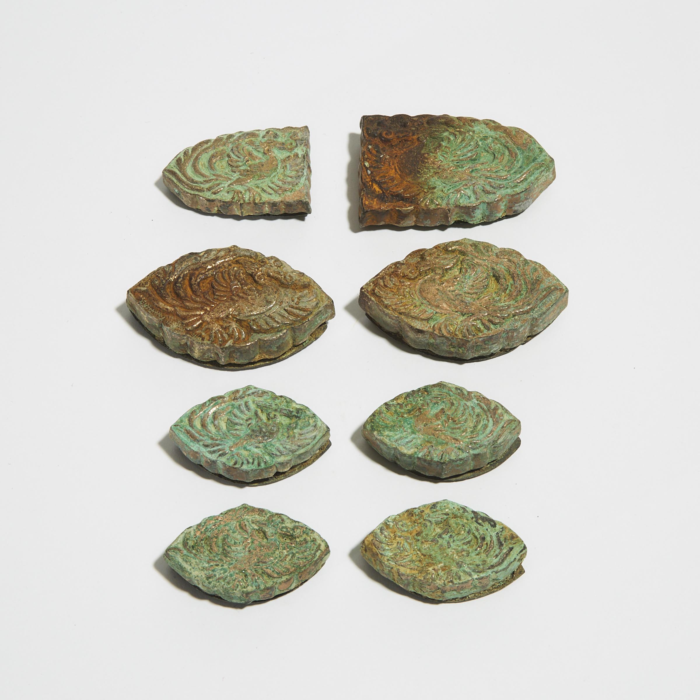 A Group of Eight Bronze Repoussé Belt Ornaments, Die Xie, Possibly Liao Dynasty 