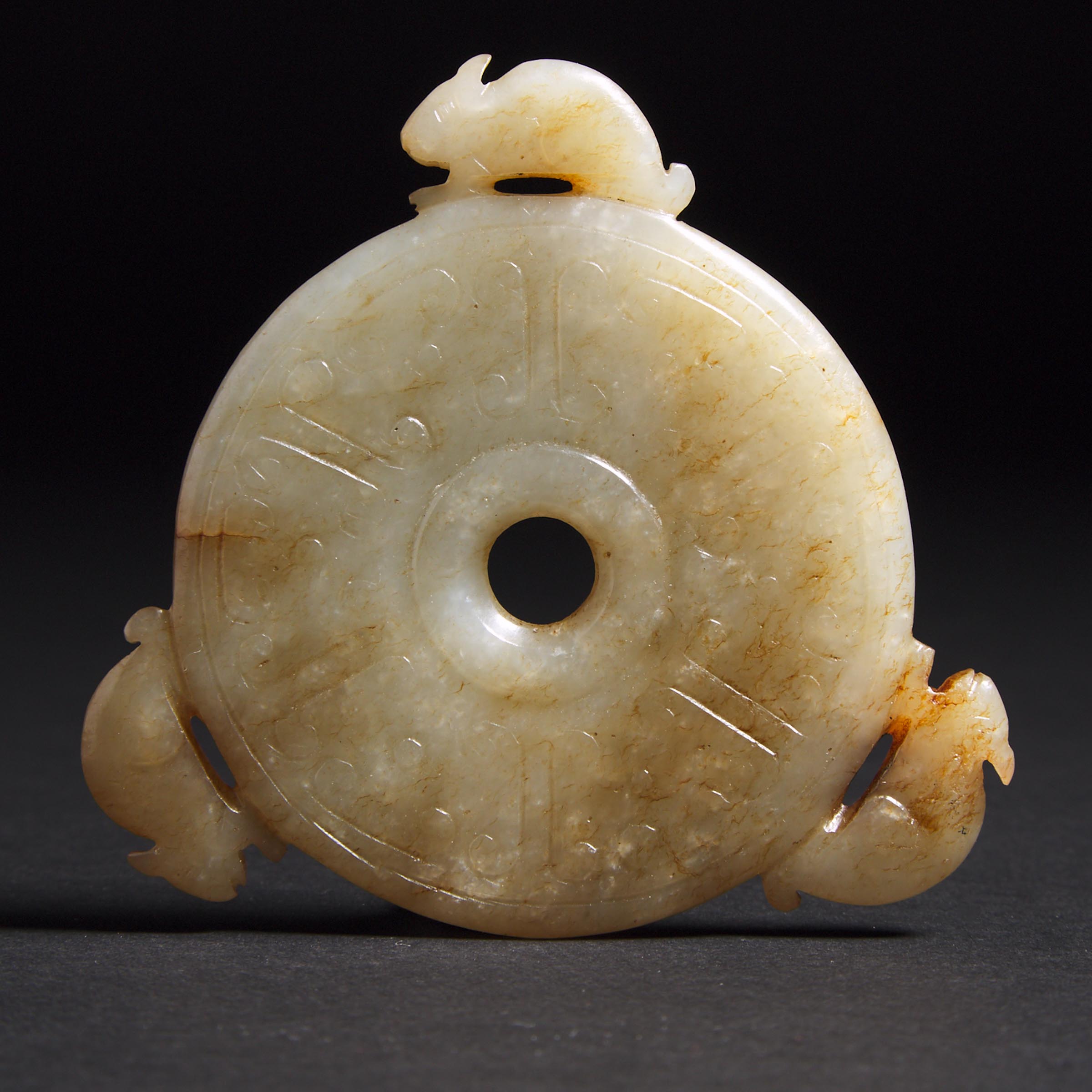 A White and Russet Jade 'Rat' Bi Disc, Ming Dynasty  
