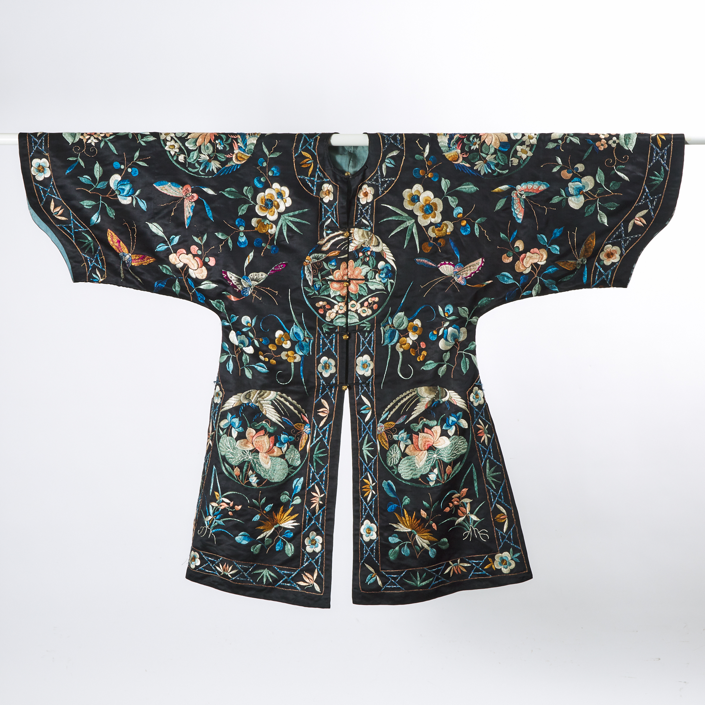 A Chinese Silk Embroidered  'Butterflies and Flowers' Overcoat, Late Qing Dynasty, 19th Century