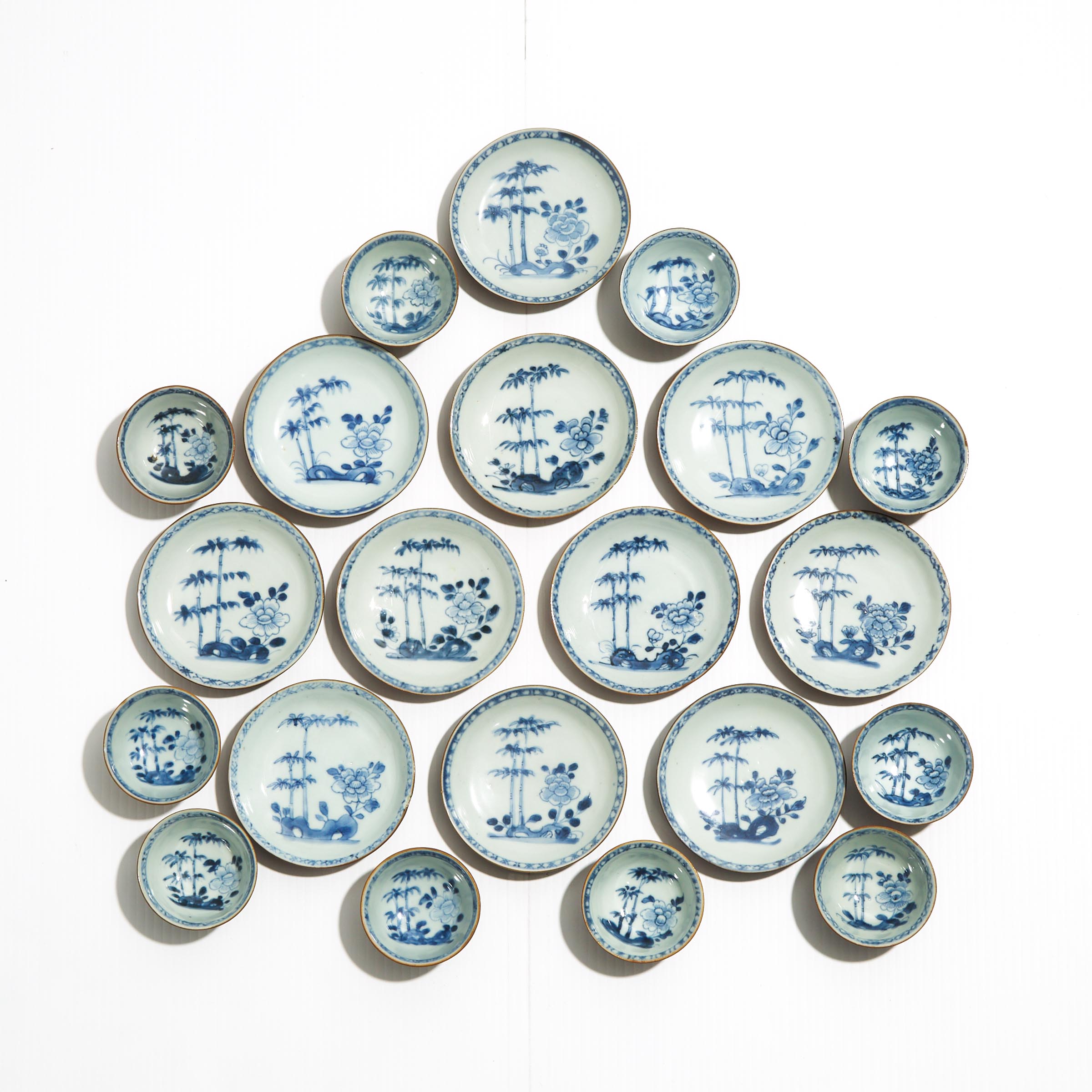 A Set of Twenty-One 'Batavian Bamboo and Peony' Pattern Teabowls and Saucers from the Nanking Cargo, Qianlong Period, Circa 1750