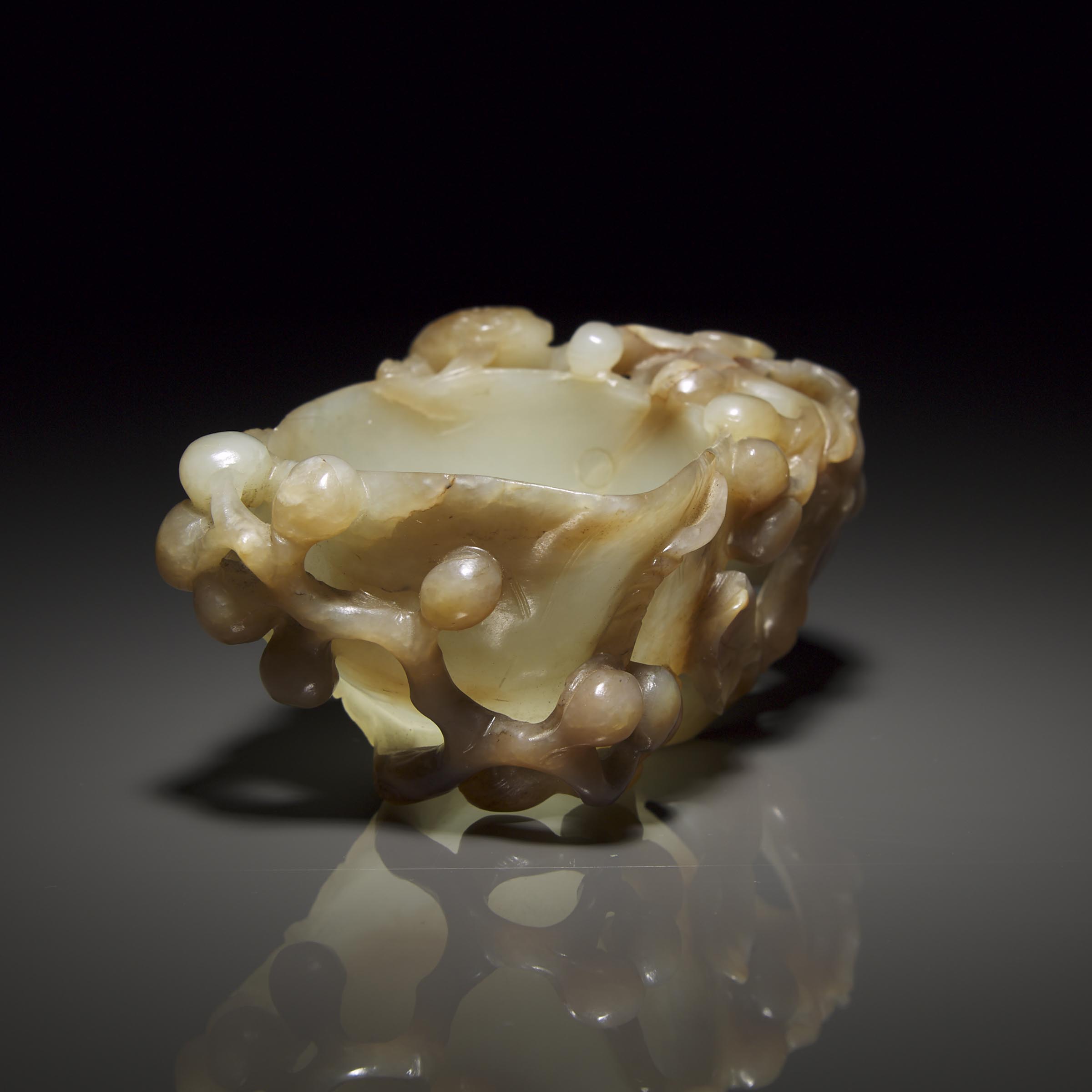A Pale Celadon and Russet Jade 'Chilong' Pouring Vessel, Ming Dynasty