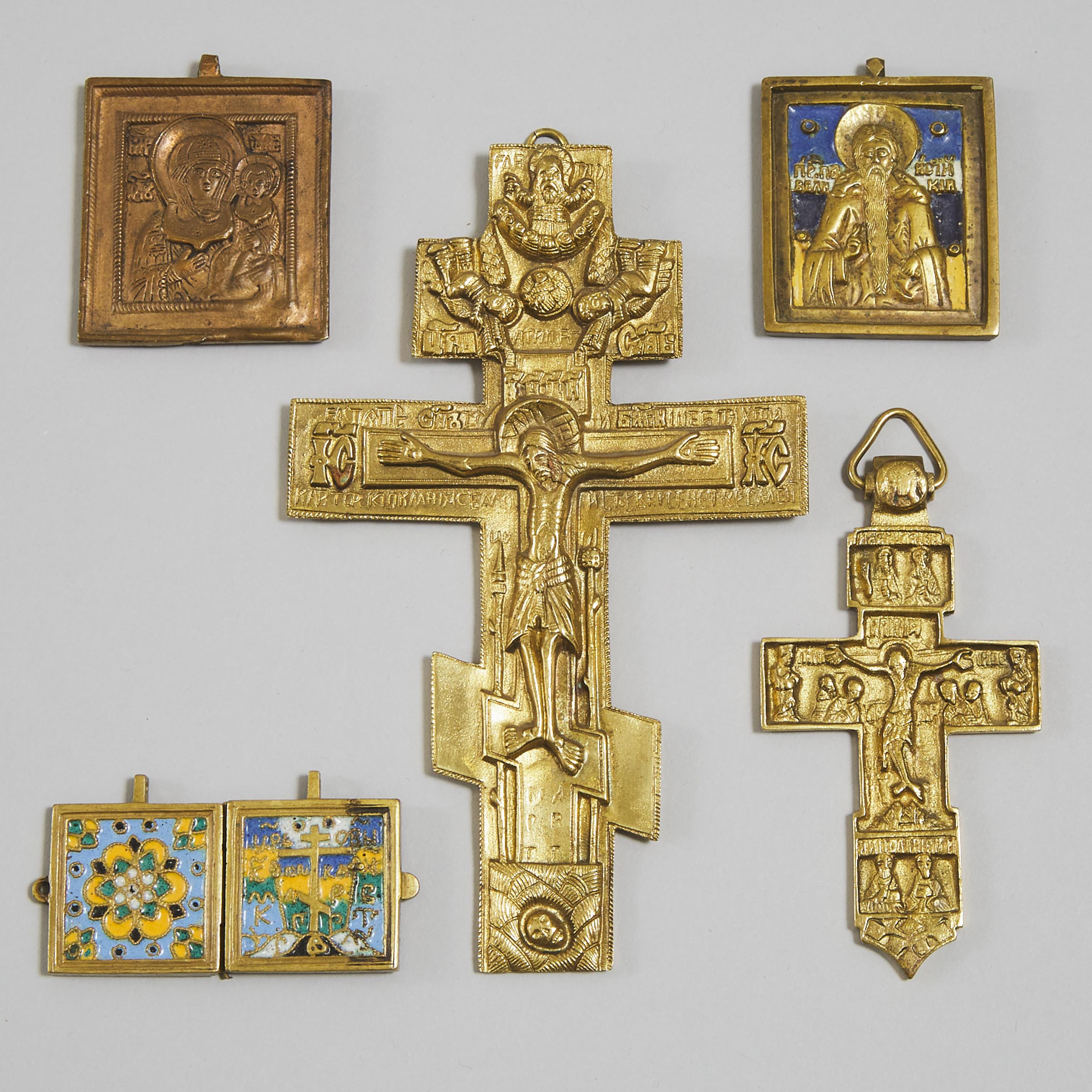 Five Russian Bronze and Enamelled Bronze Travelling Icons, 20th century