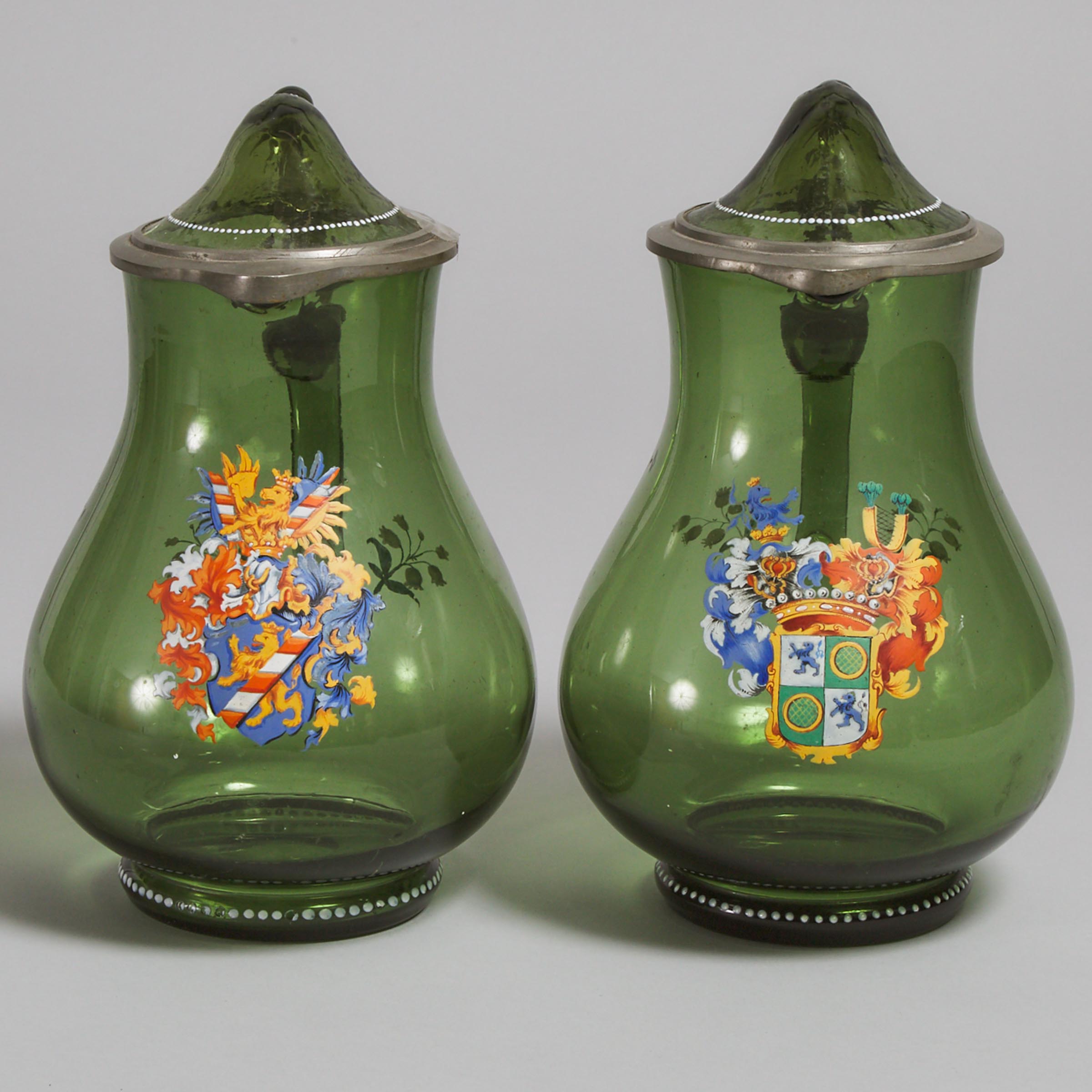 Pair of German Pewter Mounted Armorial Enameled Green Glass Covered Jugs, late 19th century