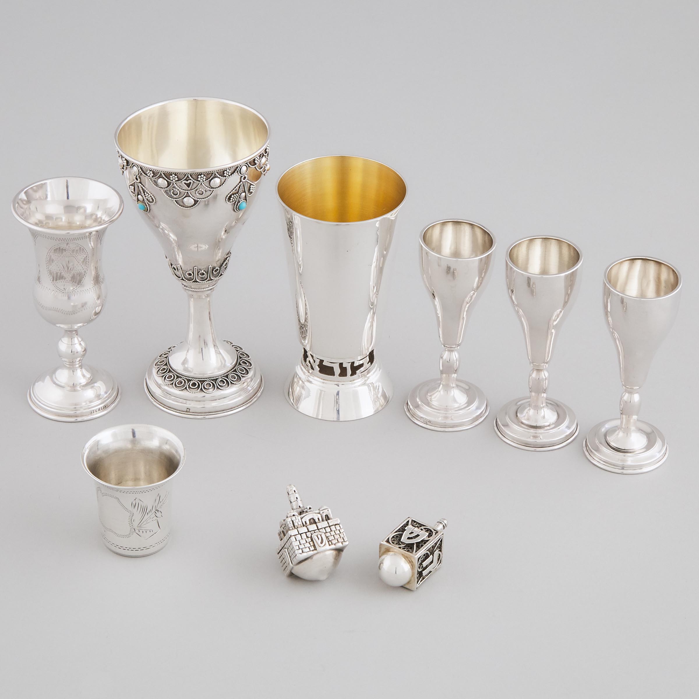 Seven Various Silver Kiddush Cups and Two Dreidels, 20th century