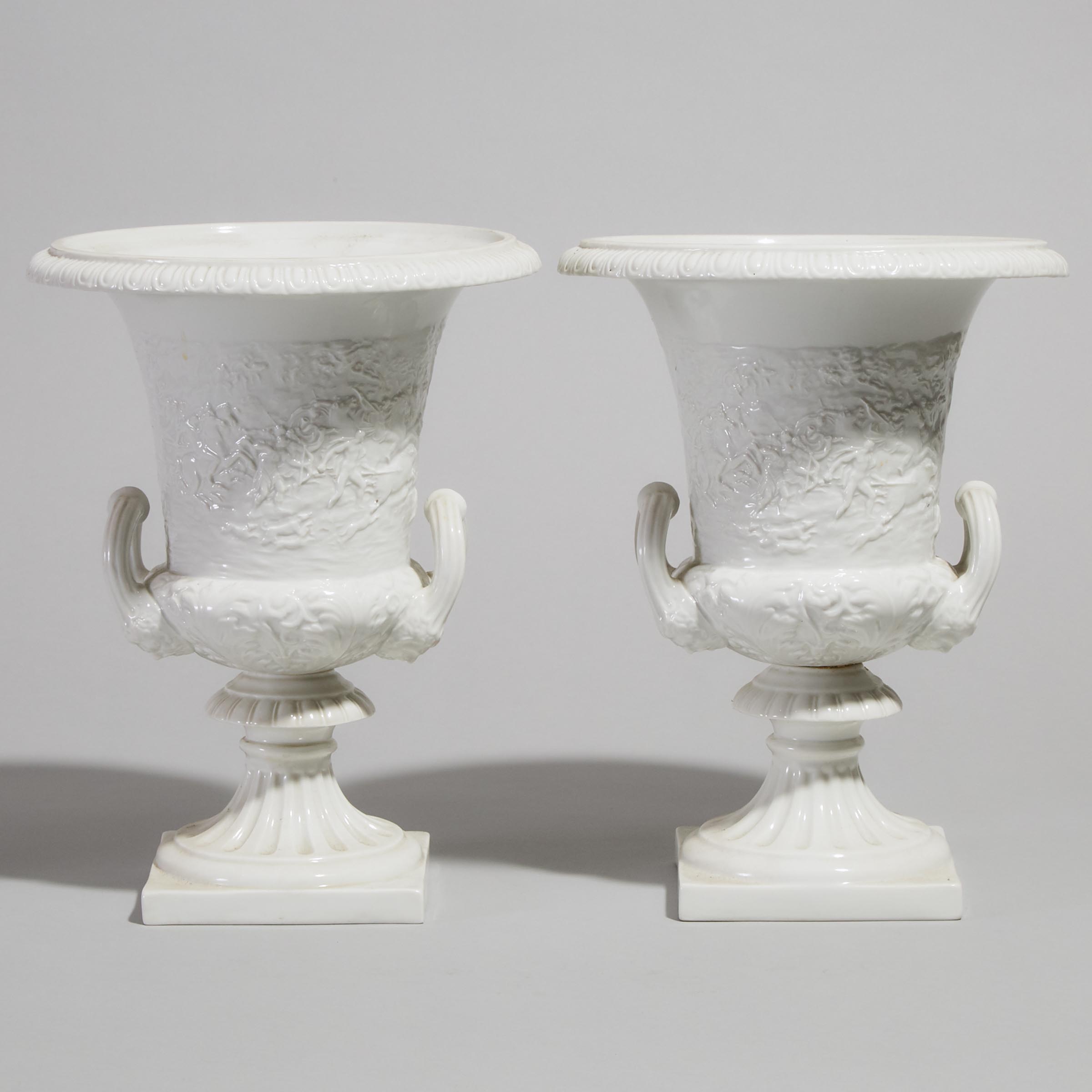 Pair of 'Naples' Moulded and White Glazed Campana Shaped Vases, 20th century