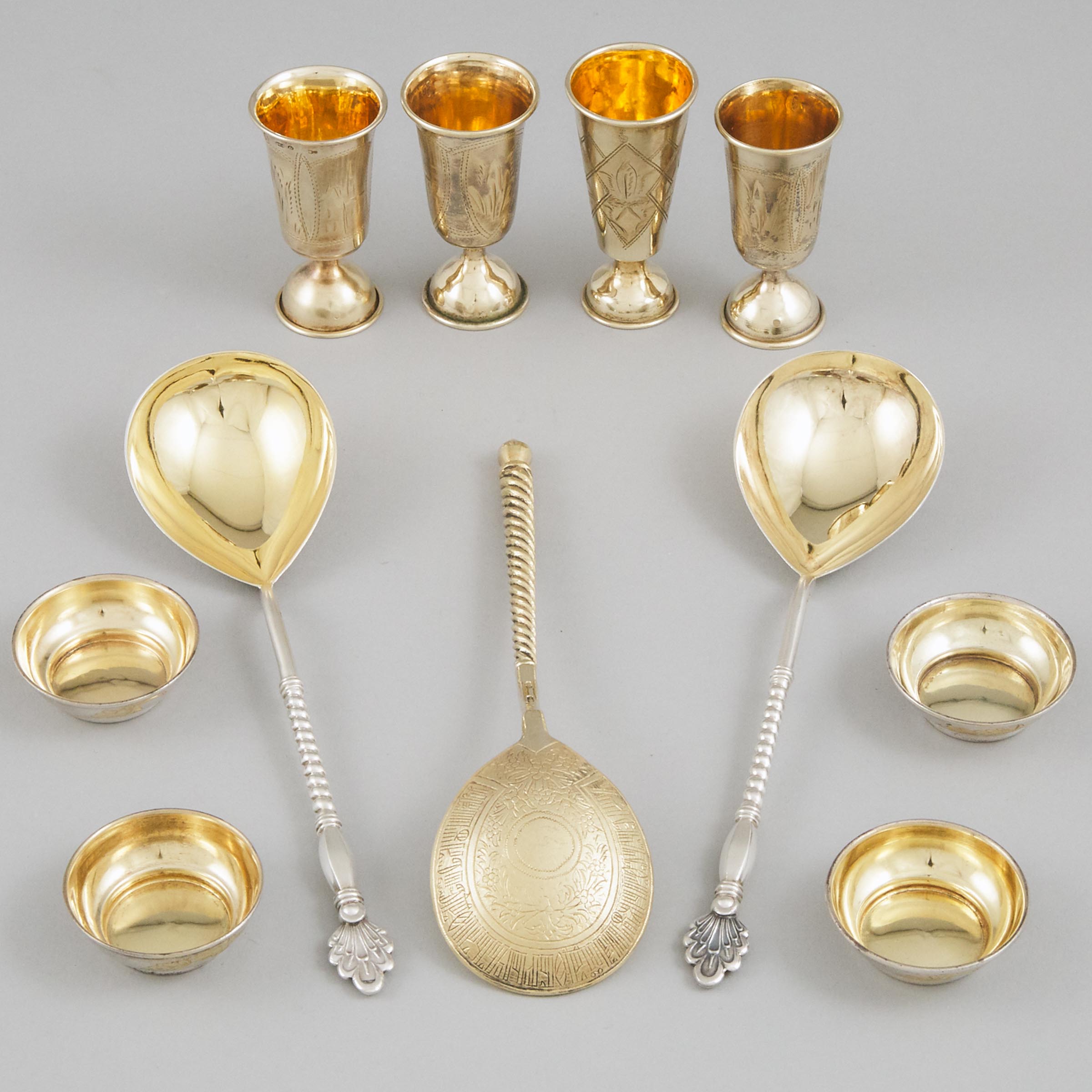 Four Russian Silver and Silver-Gilt Vodka Cups, Four Small Bowls and Three Spoons, late 19th/early 20th century