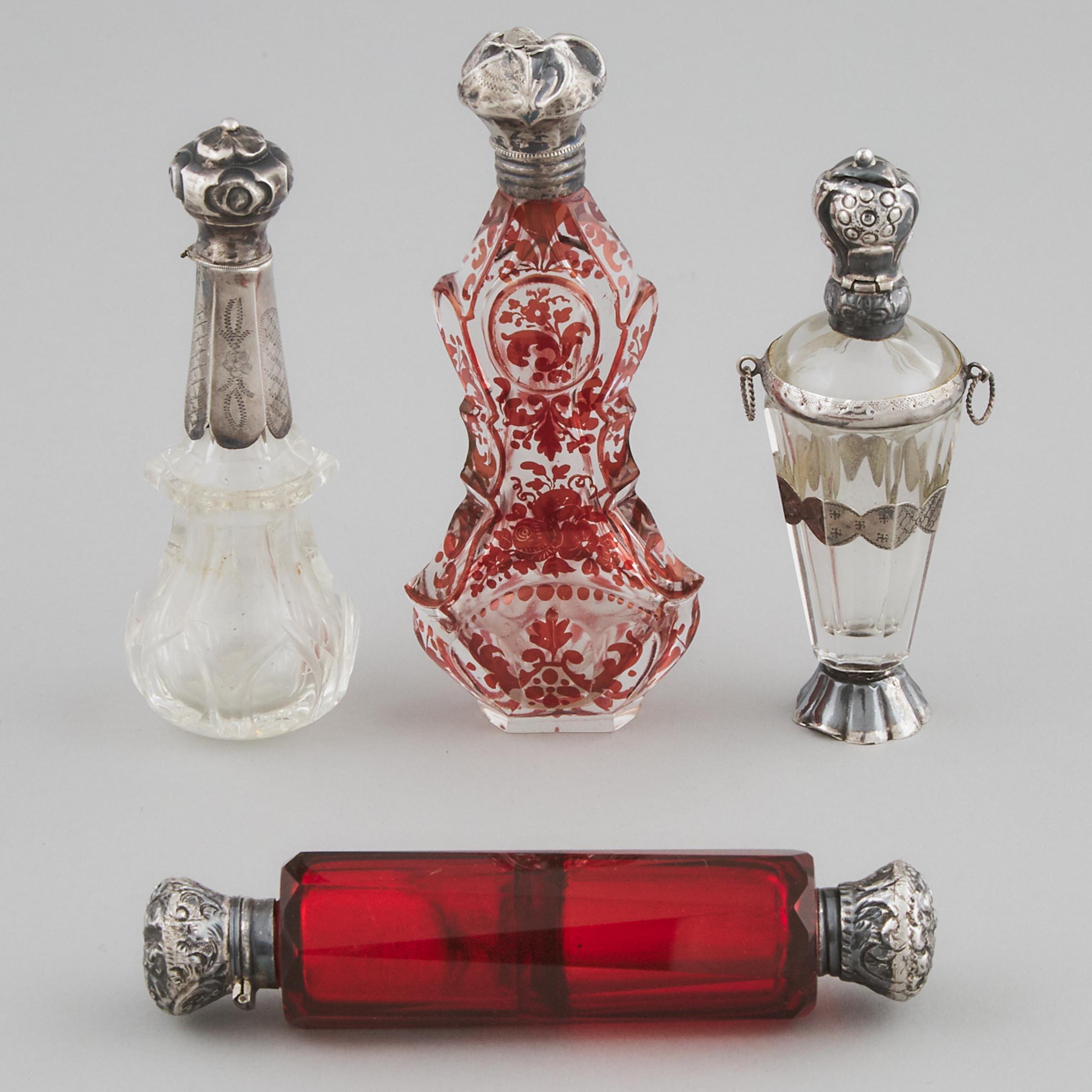 Three Dutch Silver Mounted Glass Perfume Bottles and a Double-Ended Phial, late 19th century