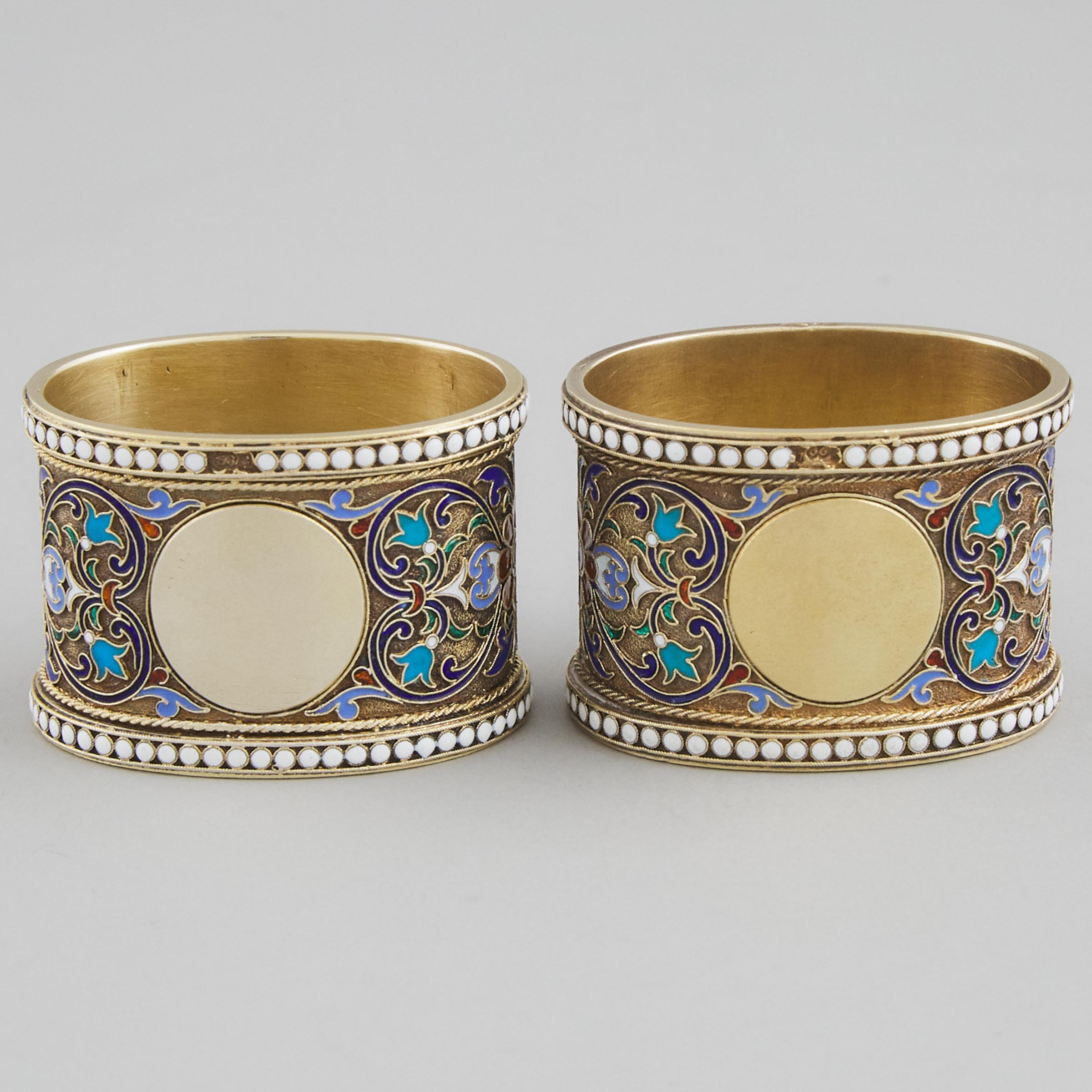 Pair of Russian Silver-Gilt and Cloisonné Enamel Oval Napkin Rings, Moscow, 1887(?)