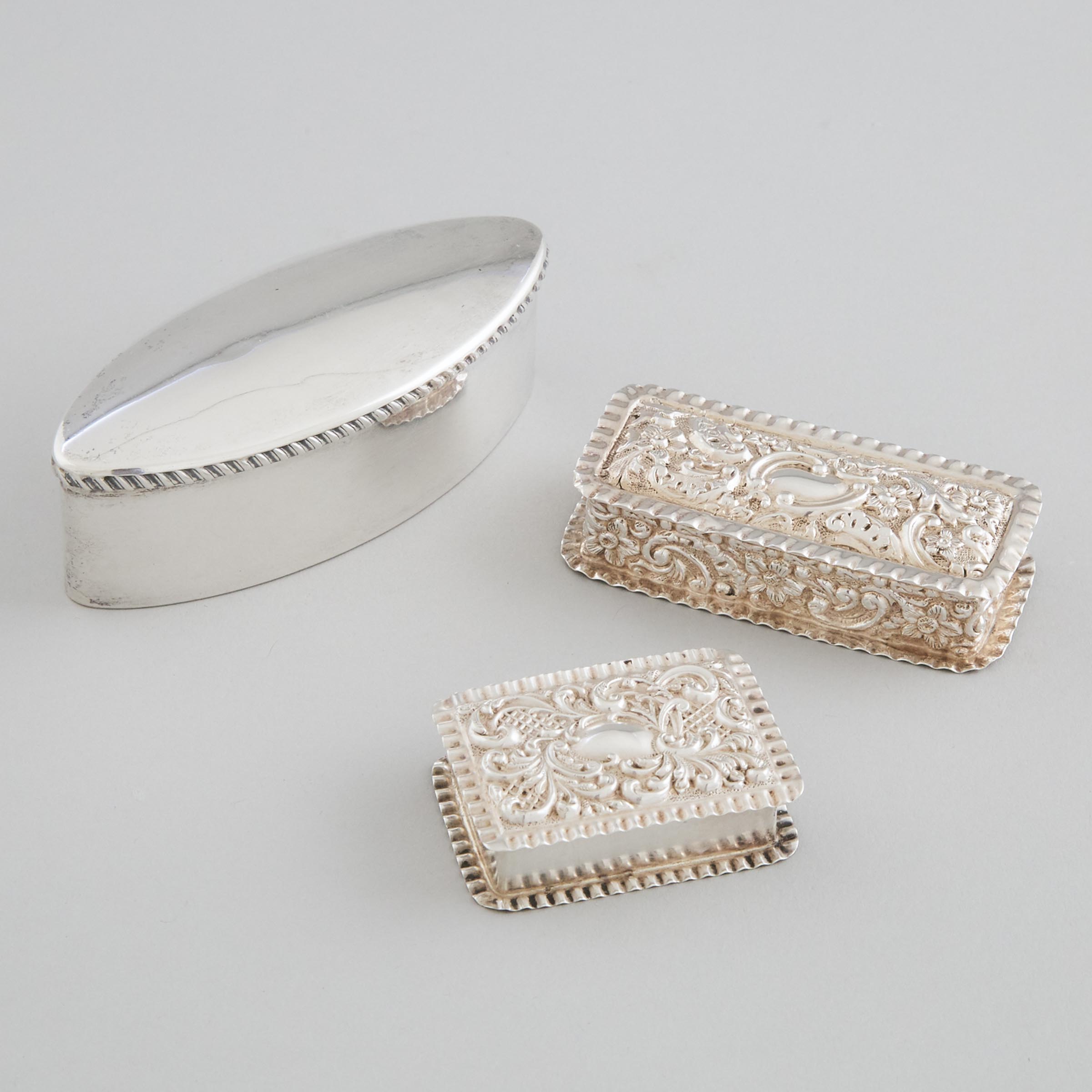Edwardian Silver Oval Ring Box and Two Rectangular Boxes, Stokes & Ireland, Chester, 1904, Synyer & Beddoes, Birmingham, 1899 and Adie & Lovekin, 1902