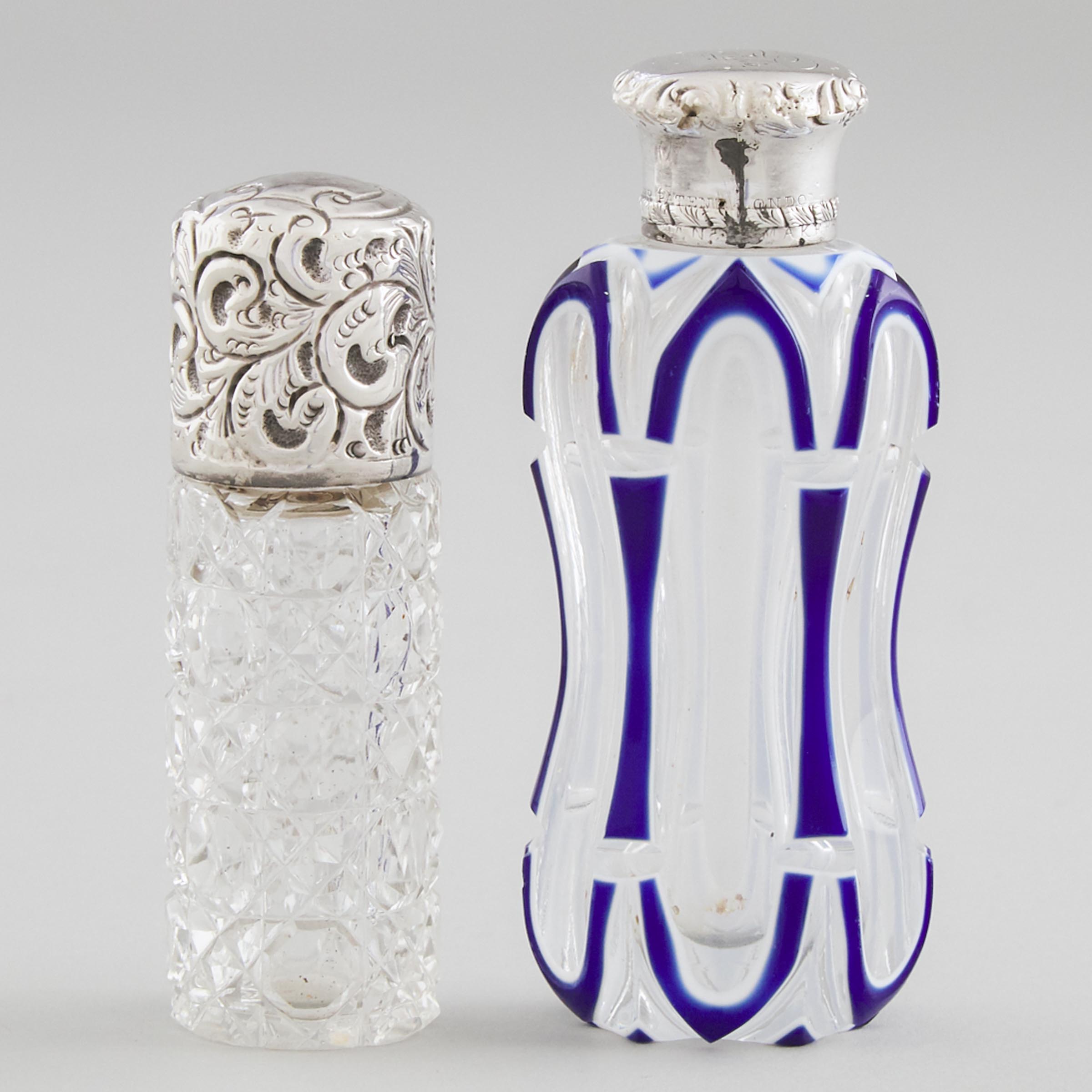 Two English Silver Mounted Glass Perfume Bottles, one John Hazelwood Worrall, London, 1902