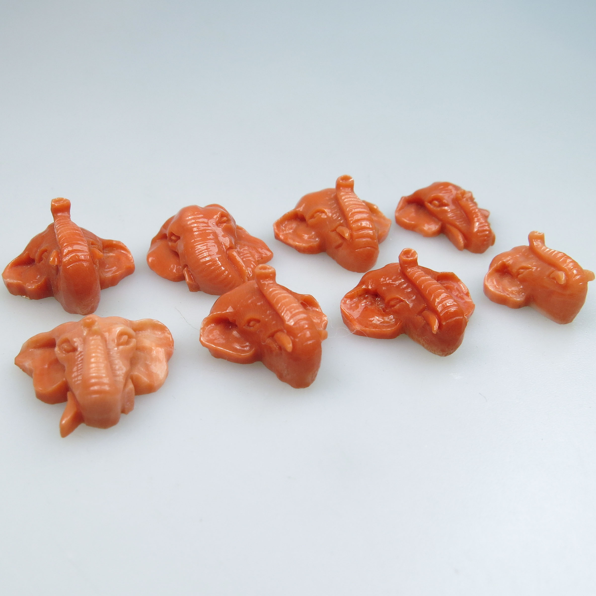 8 Carved Coral Elephant Heads