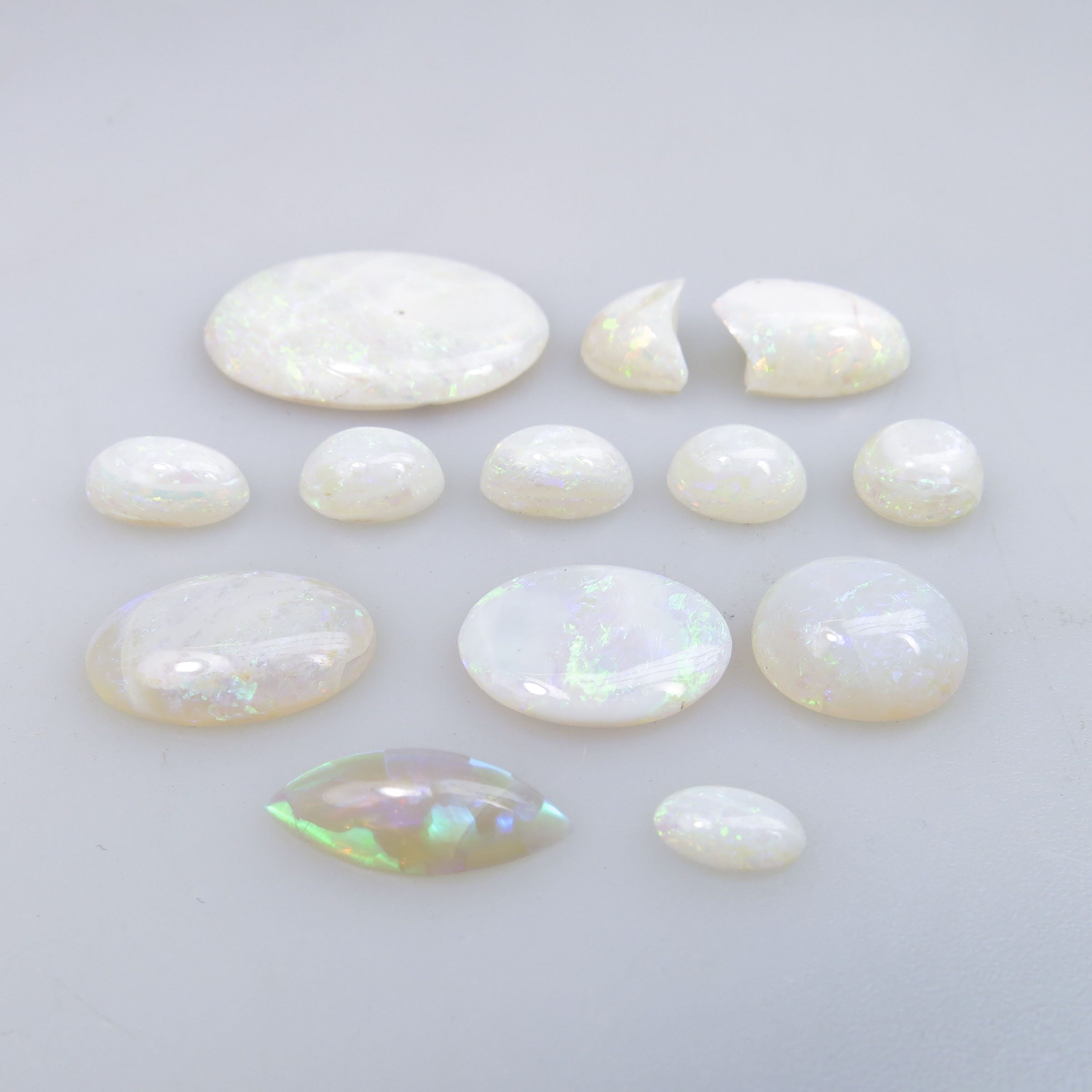 12 Oval, Circular And Navette Opal Cabochons