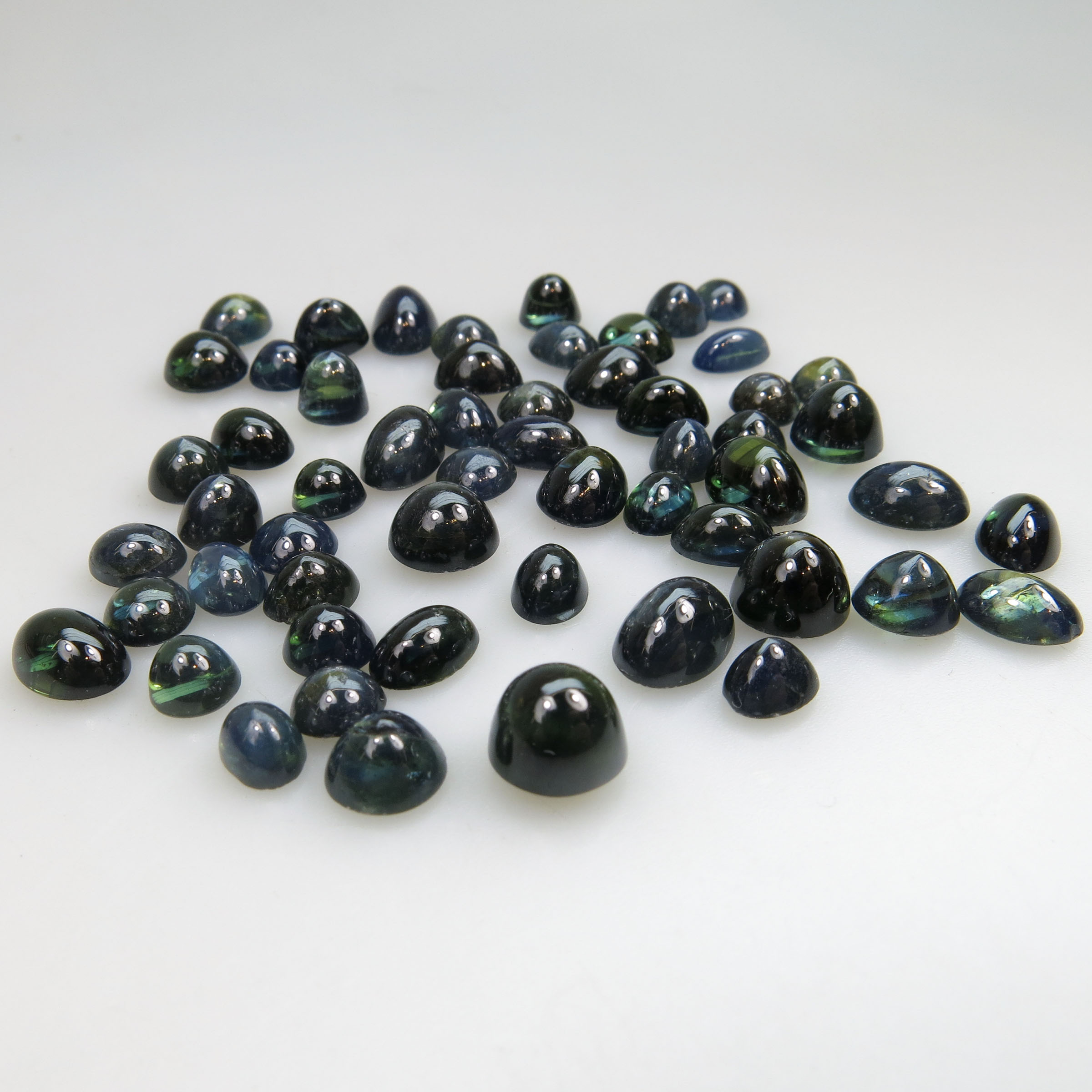 56 Circular And Oval Sapphire Cabochons