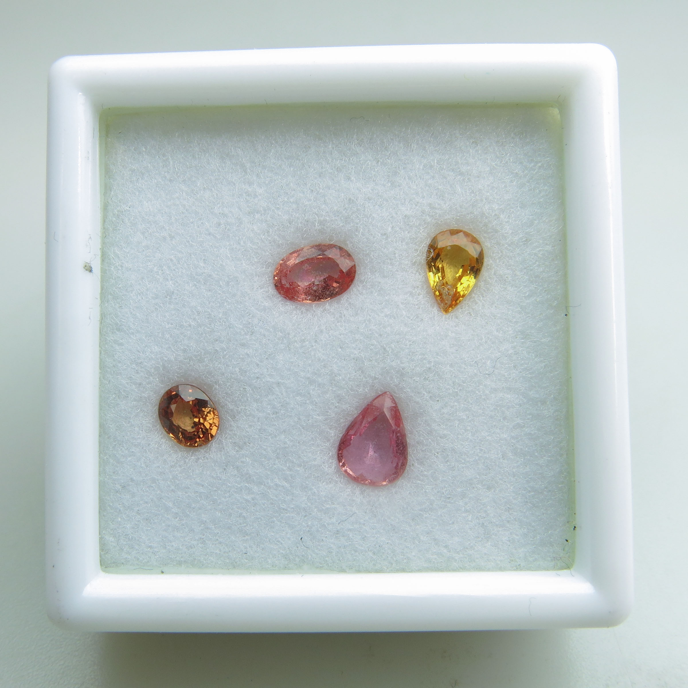Four Pear And Oval Cut Padparadscha Sapphires