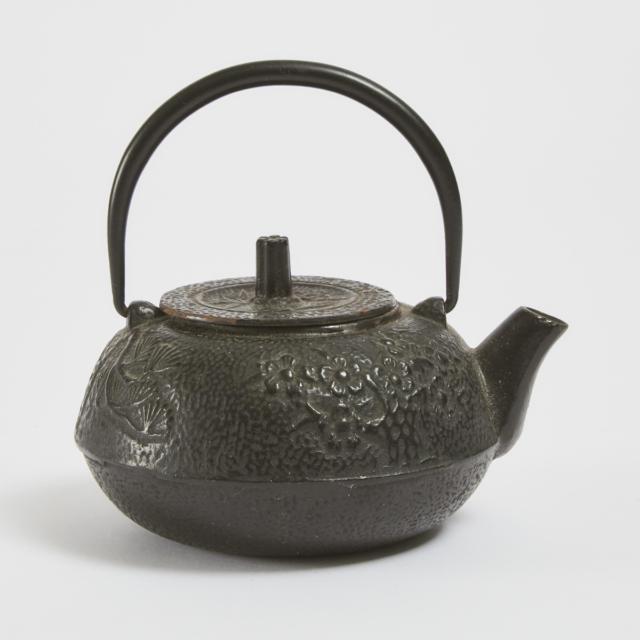 A Japanese Cast Iron 'Three Friends of Winter' Teapot, Meiji Period