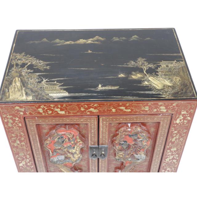 A Chinese Small Cabinet with Carved Door Panels