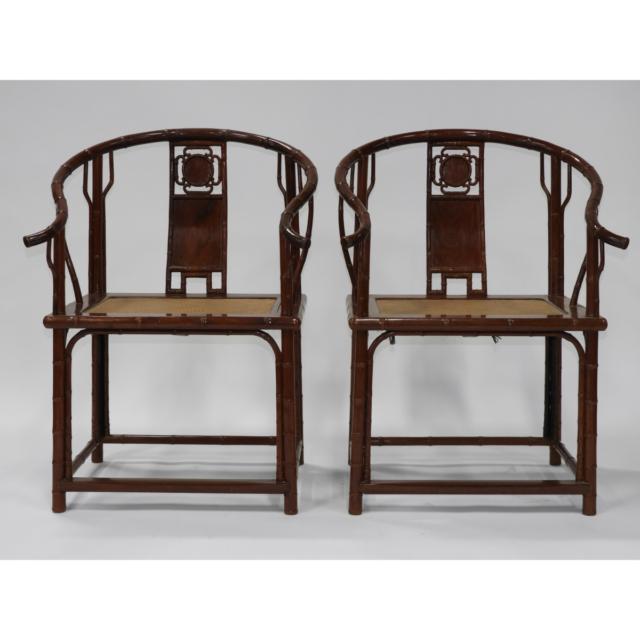 A Pair of Chinese Hardwood Horseshoe-Back Armchairs