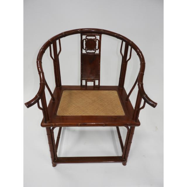 A Pair of Chinese Hardwood Horseshoe-Back Armchairs