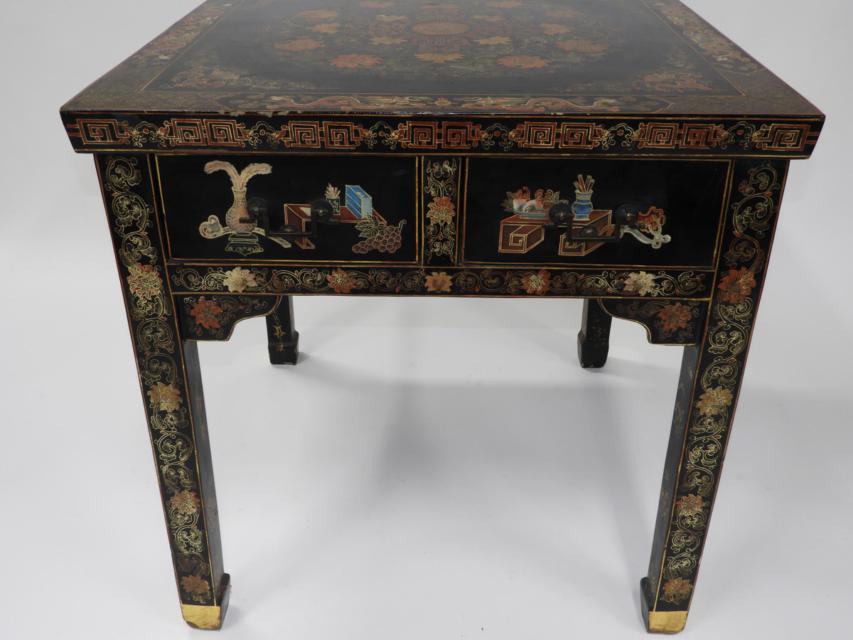 A Chinese Black Lacquer Square Table and Four Chairs