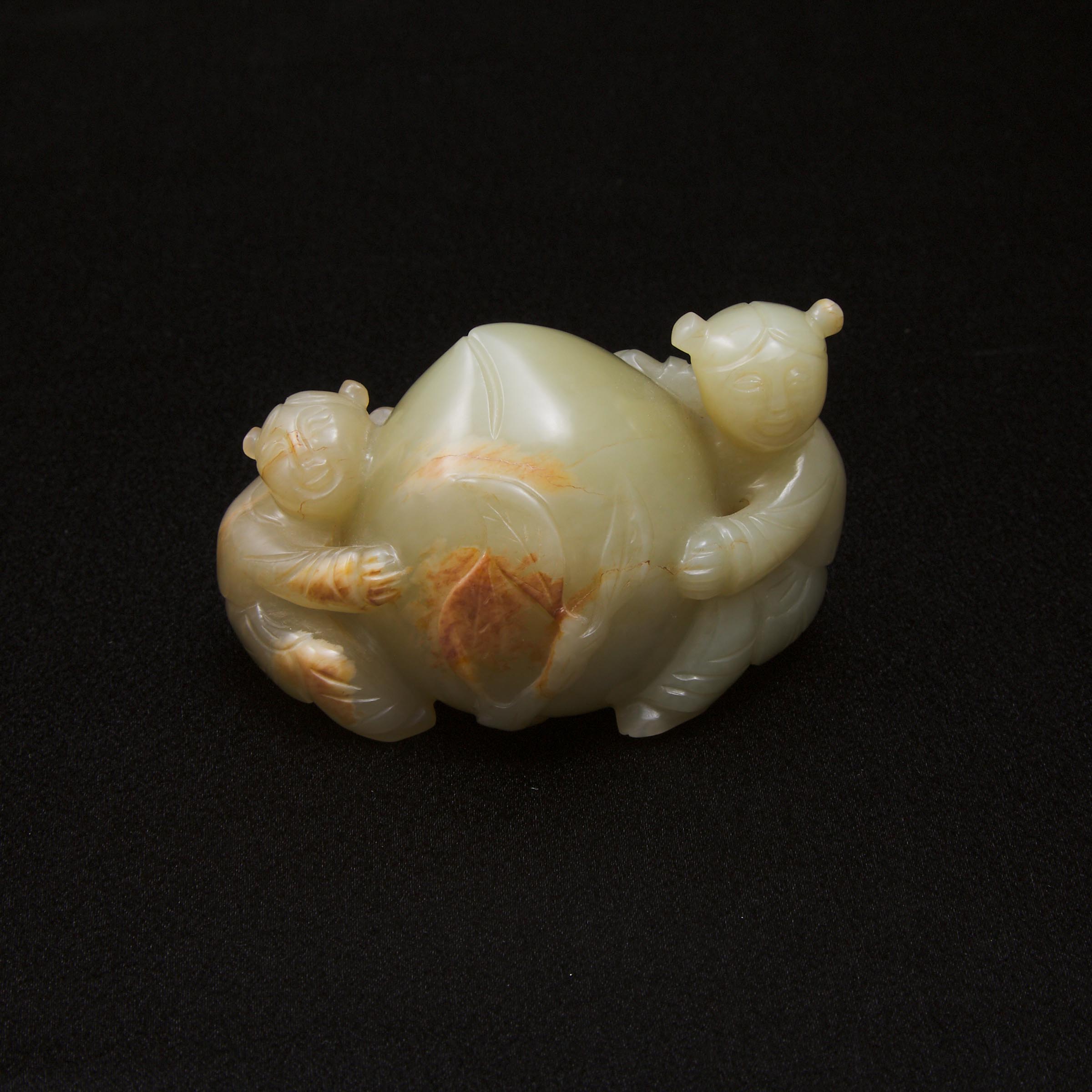 A Celadon and Russet Jade 'Boys and Peach' Carving