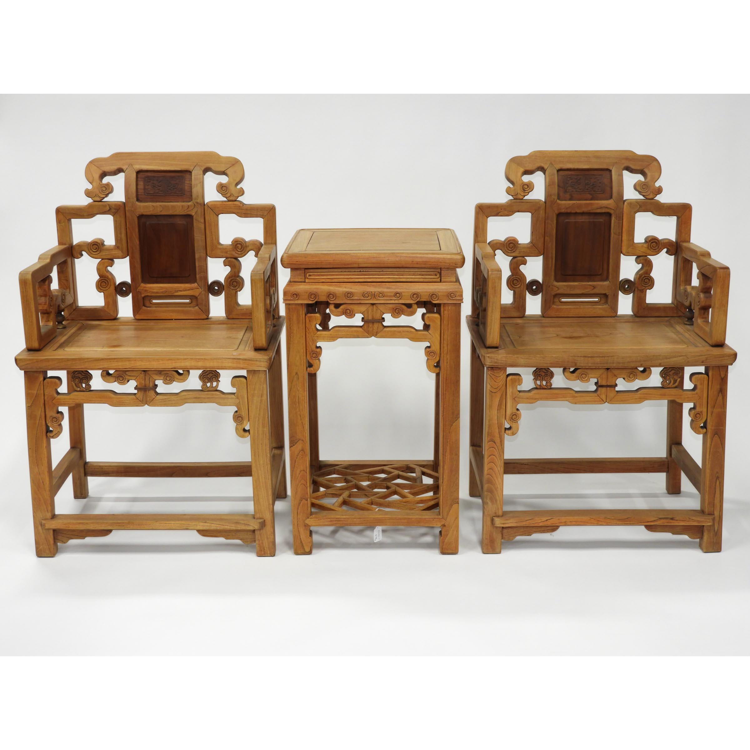 A Chinese Elmwood Table and Two Chairs