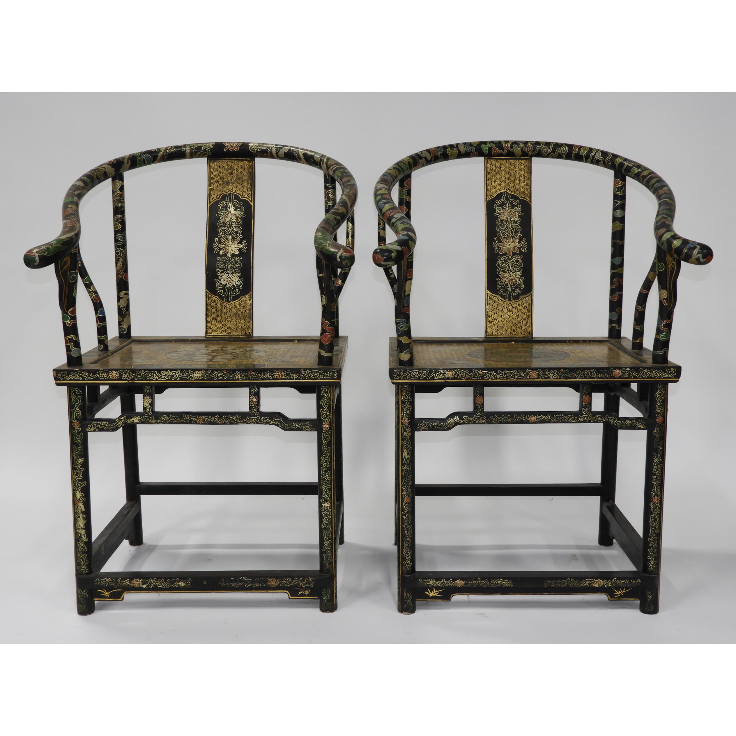 A Pair of Black Lacquer Horseshoe-Back Armchairs