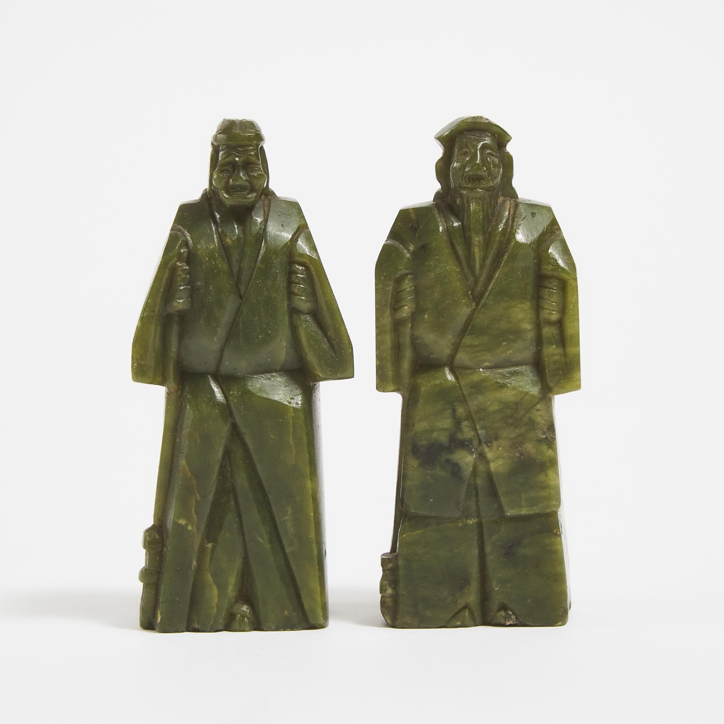 A Pair of Green Jade Figures of an Elderly Couple, Early 20th Century