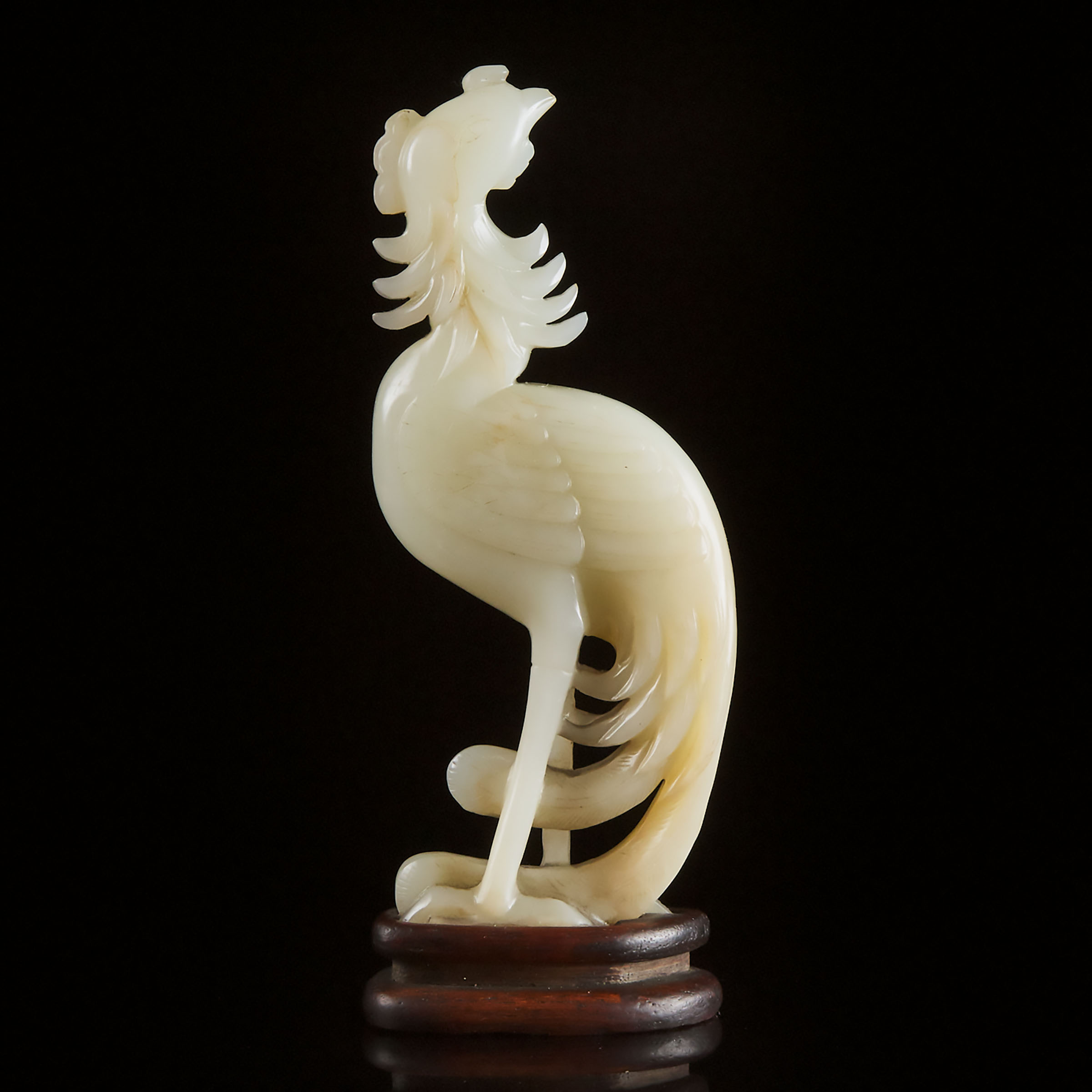 A White Jade Carved Phoenix, 19th/20th Century 