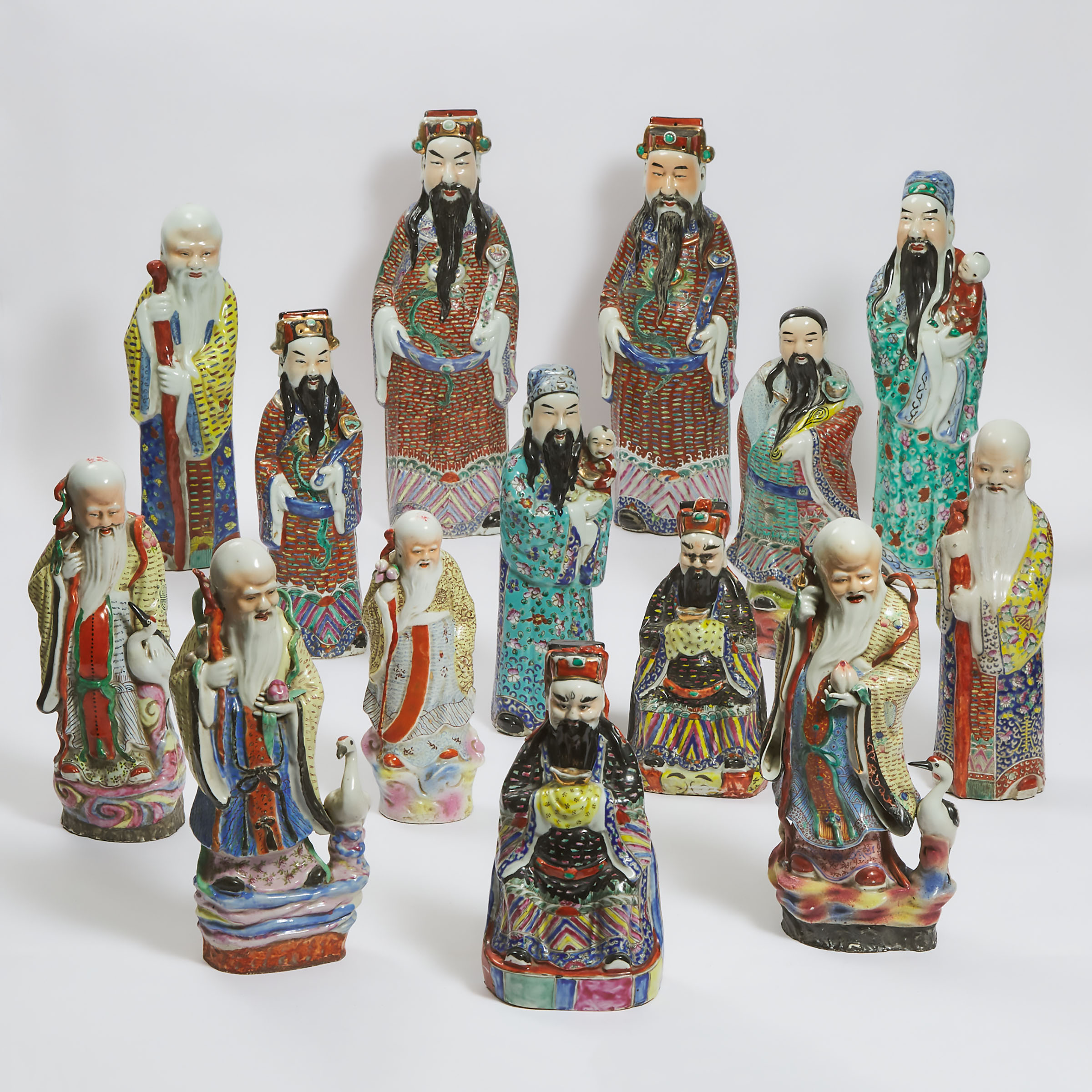 A Group of Fourteen 'Fu Lu Shou' Porcelain Figures, Republican Period and Later
