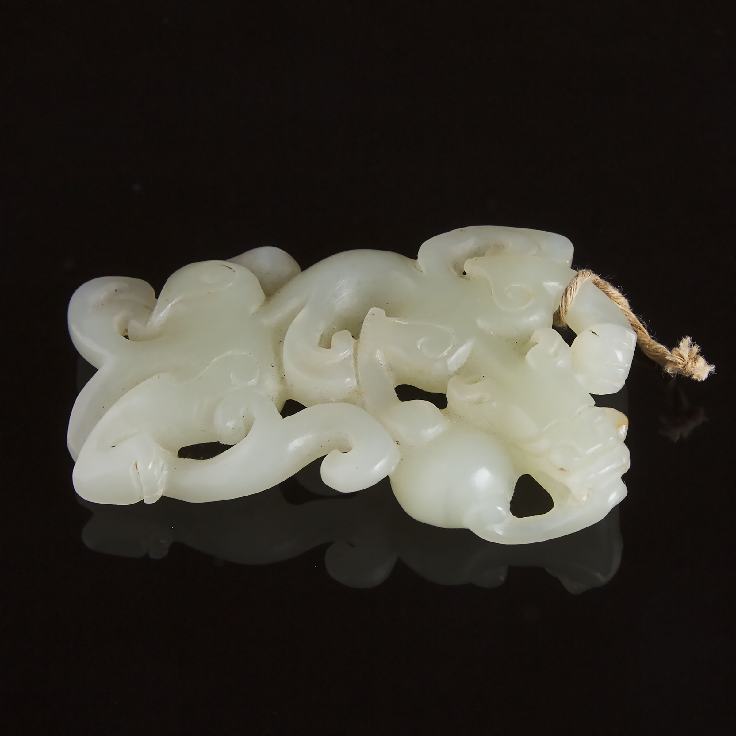 A Carved White Jade Archaistic 'Dragon' Pendant, 19th Century or Later