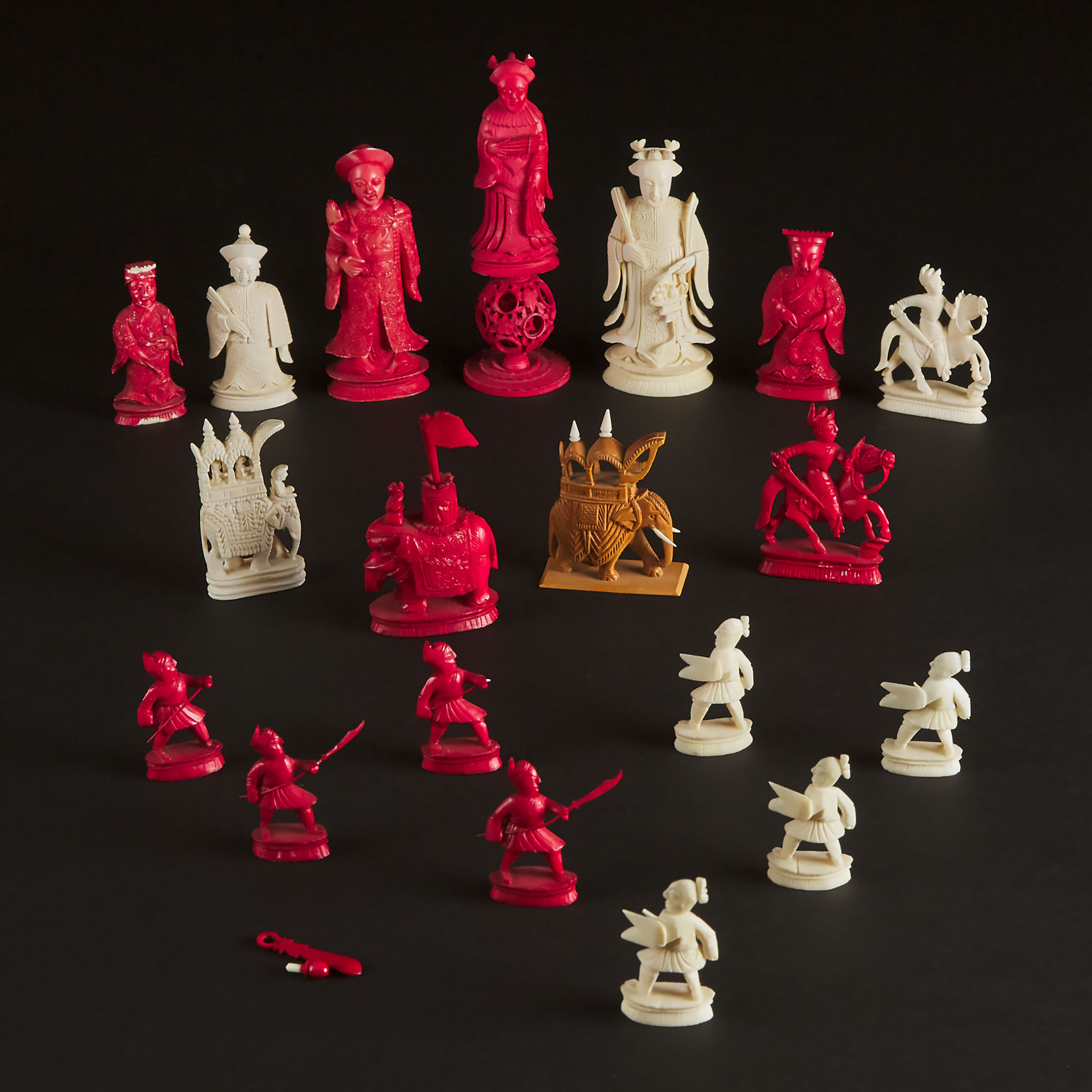 A Group of Eighteen Chinese Export Ivory Chess Pieces, 19th Century