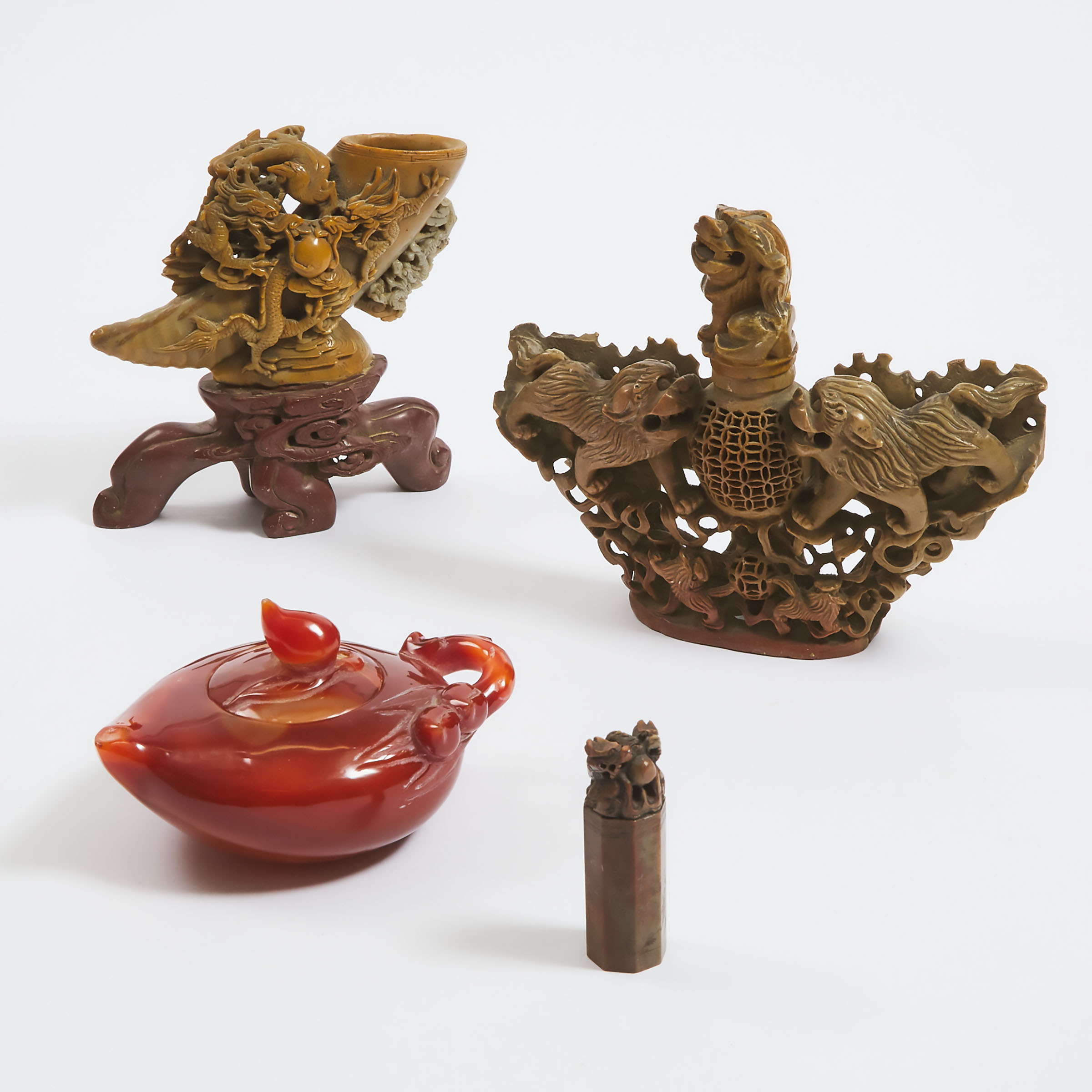 A Group of Three Chinese Soapstone Carvings, Together With a Carnelian Teapot