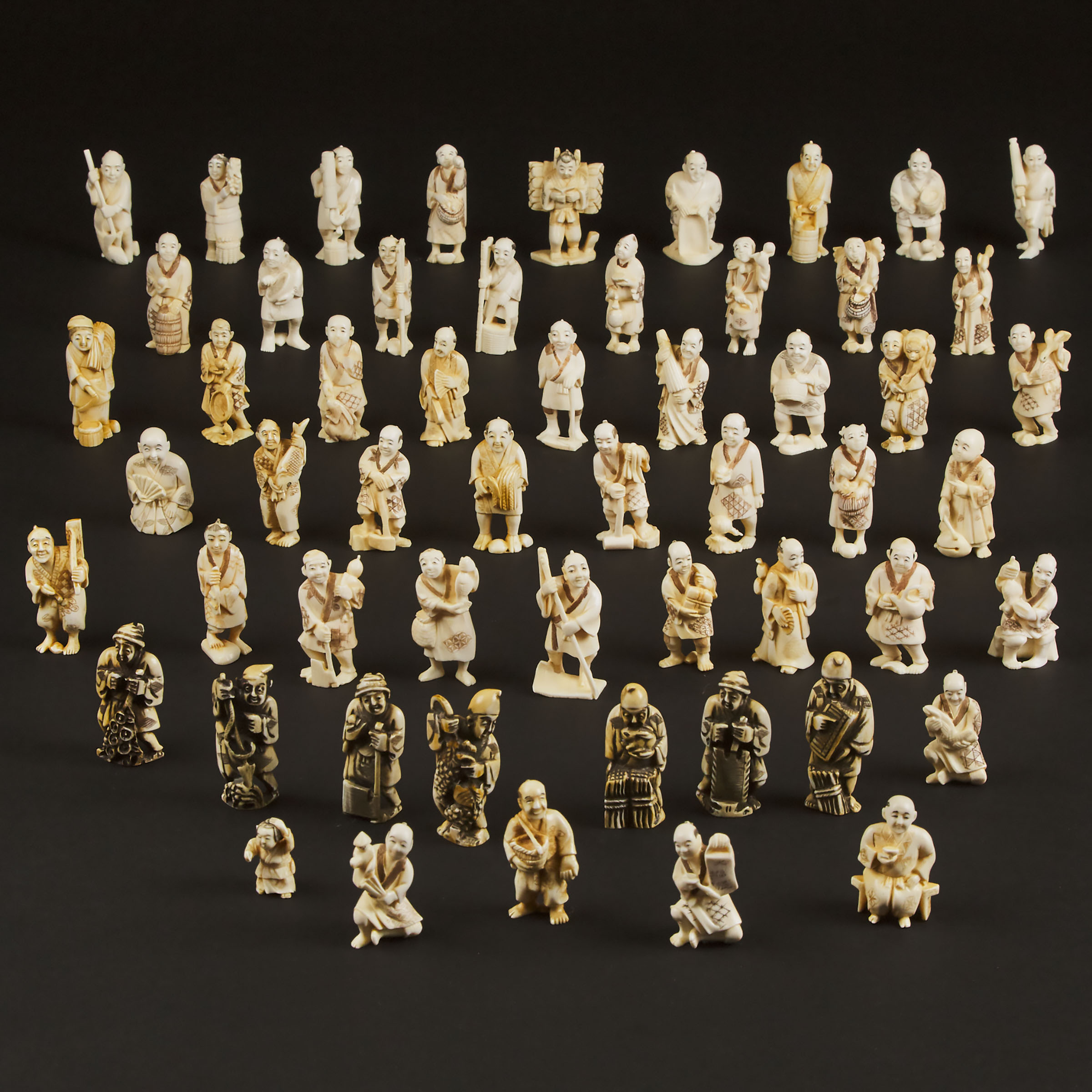 A Group of Fifty-Six Japanese Ivory Figural Netsuke, Mid 20th Century