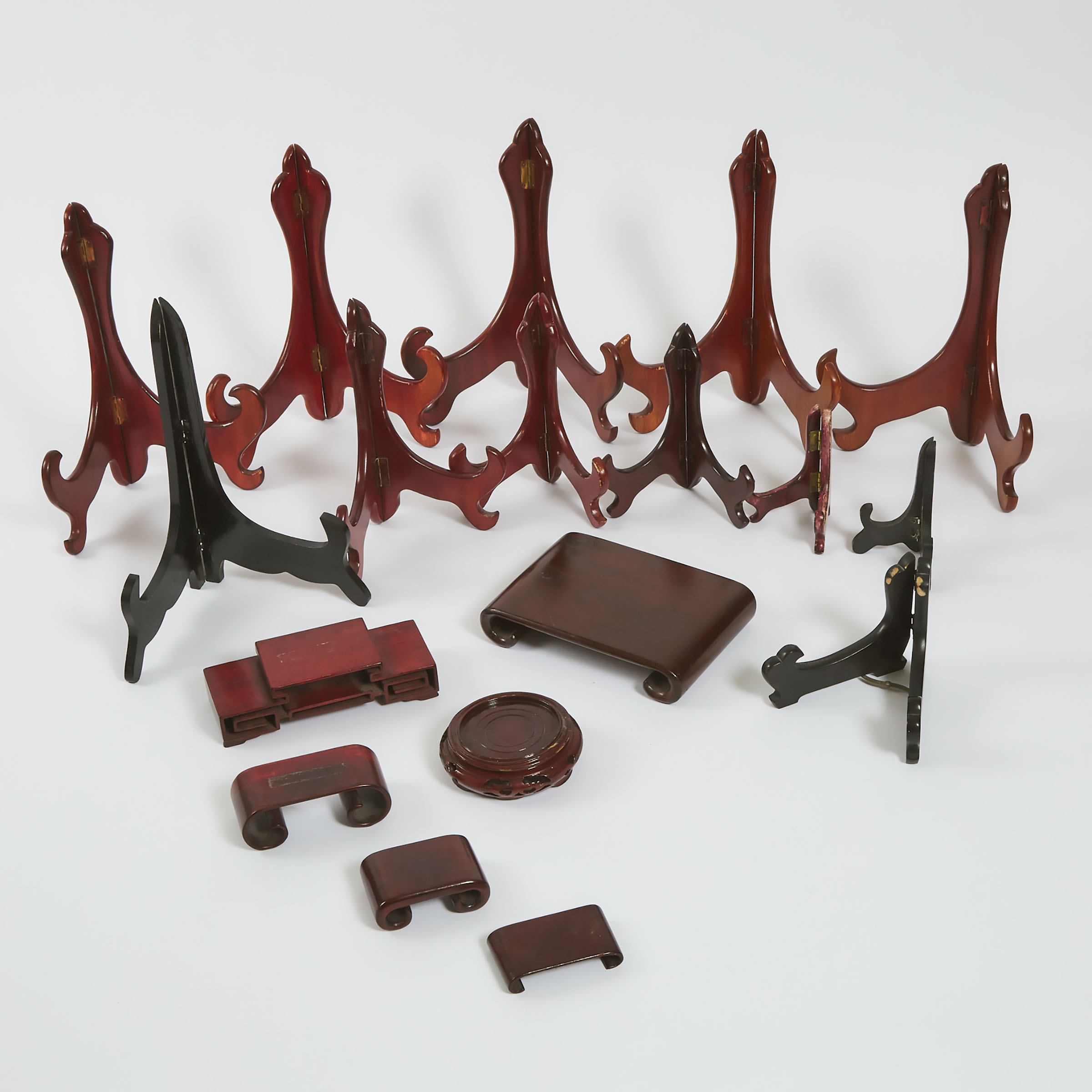 A Group of Eighteen Chinese Scroll-Form, Plate, and Other Miscellaneous Wood Stands