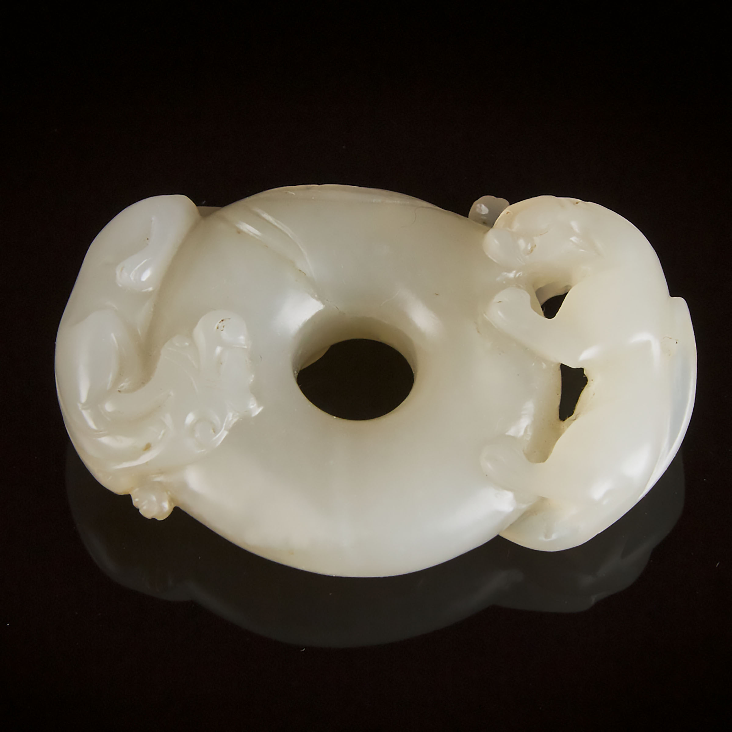 A White Jade 'Chi-Dragon' Circular Pendant, Late Qing Dynasty, 19th/20th Century