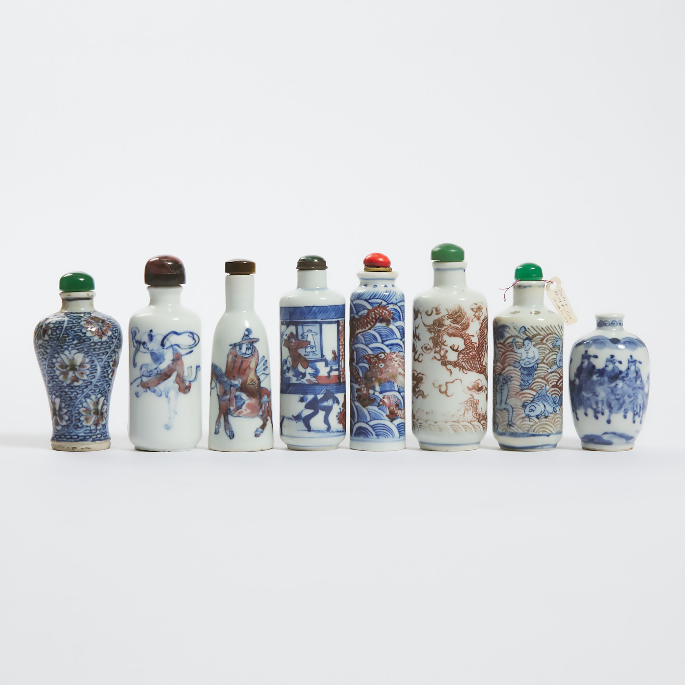 A Group of Eight Underglaze-Blue and Copper-Red Snuff Bottles, 19th Century 
