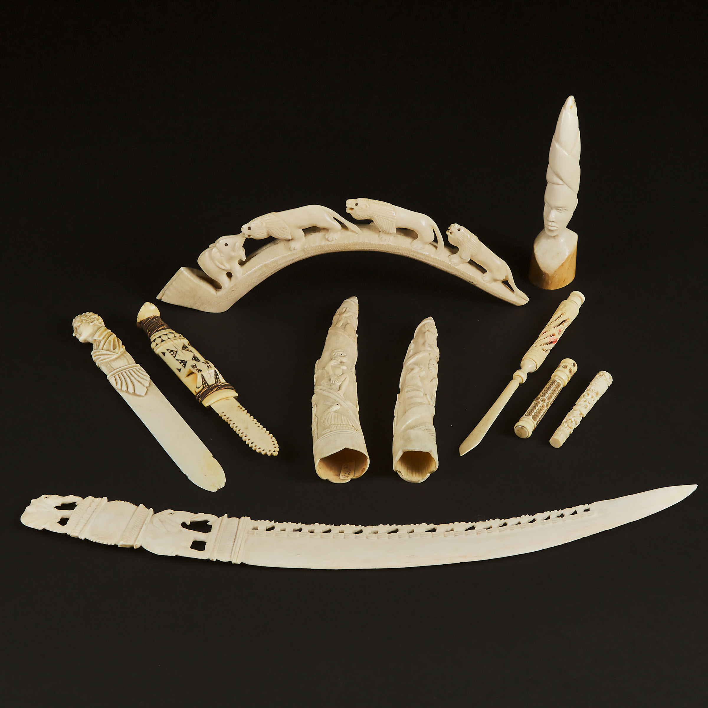 A Group of Ten Ivory and Bone Needle Cases, Letter Openers, and Tusk Carvings, Mid 20th Century