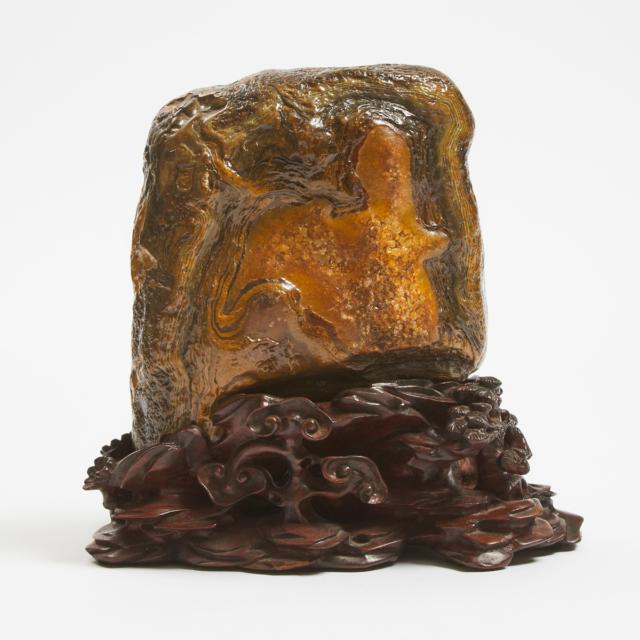 A Chinese Agate Scholar's Rock on a Carved Hardwood Stand 