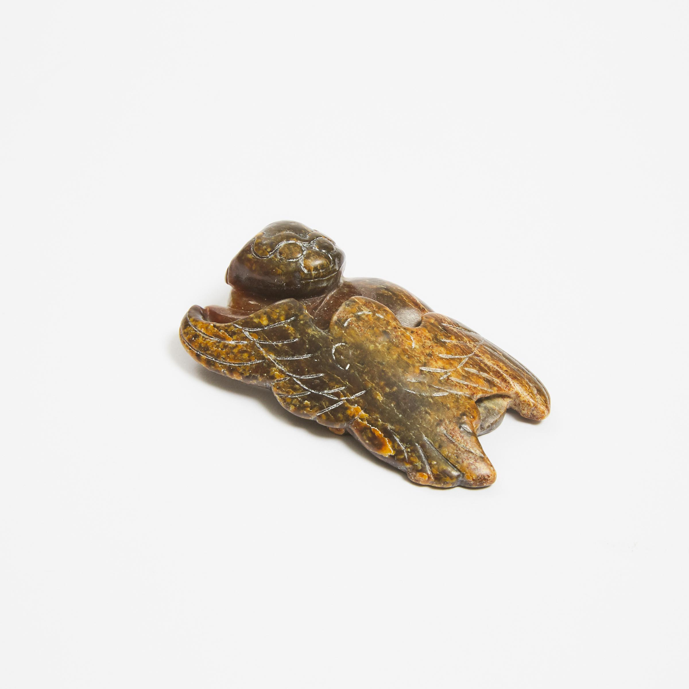 A Yellow and Russet Jade 'Bear and Eagle' Group, Ming Dynasty
