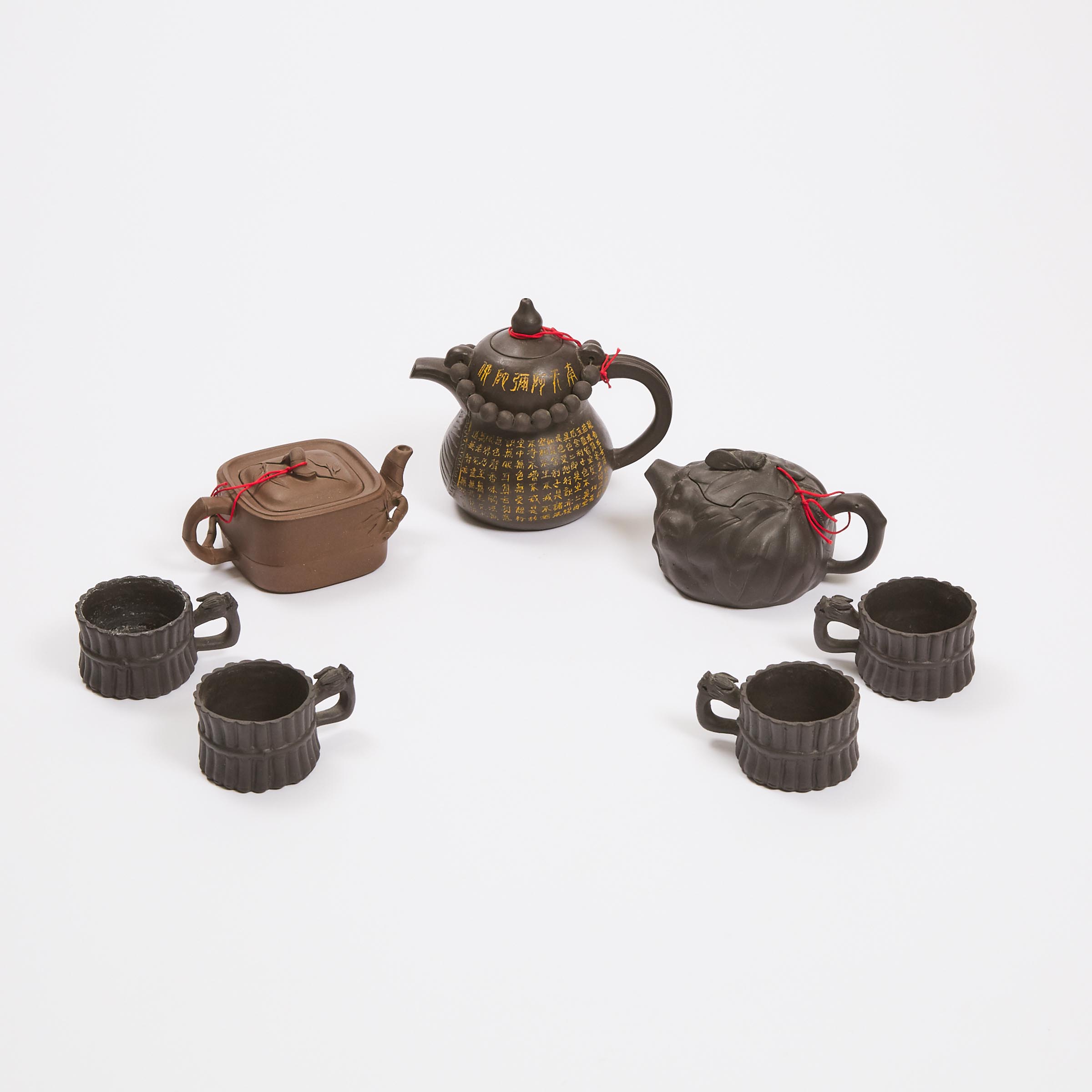 A Group of Three Zisha Teapots, Together With Four Tea Cups
