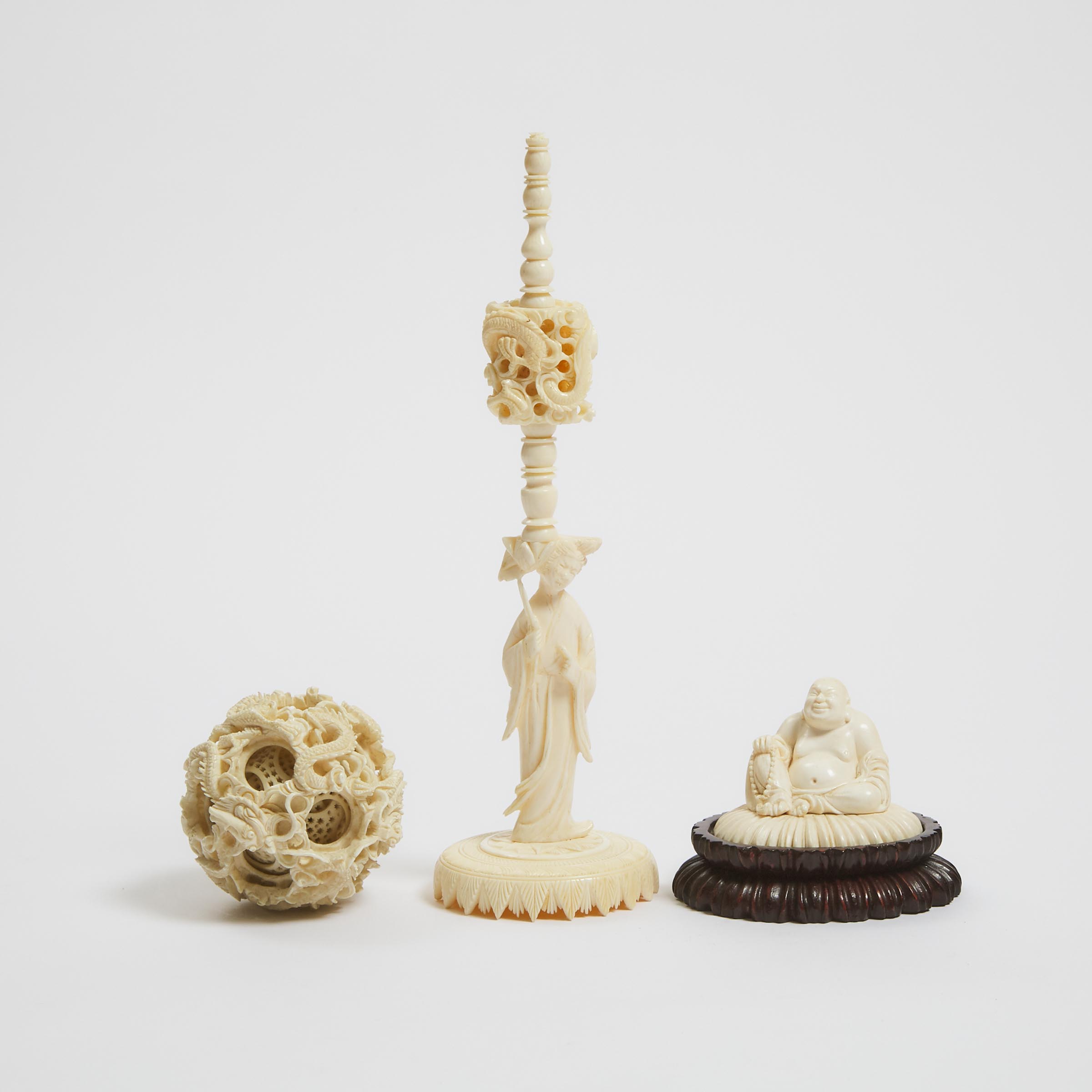 An Ivory Puzzle Ball and Stand, Together With a Carving of Budai, Late 19th/Early 20th Century