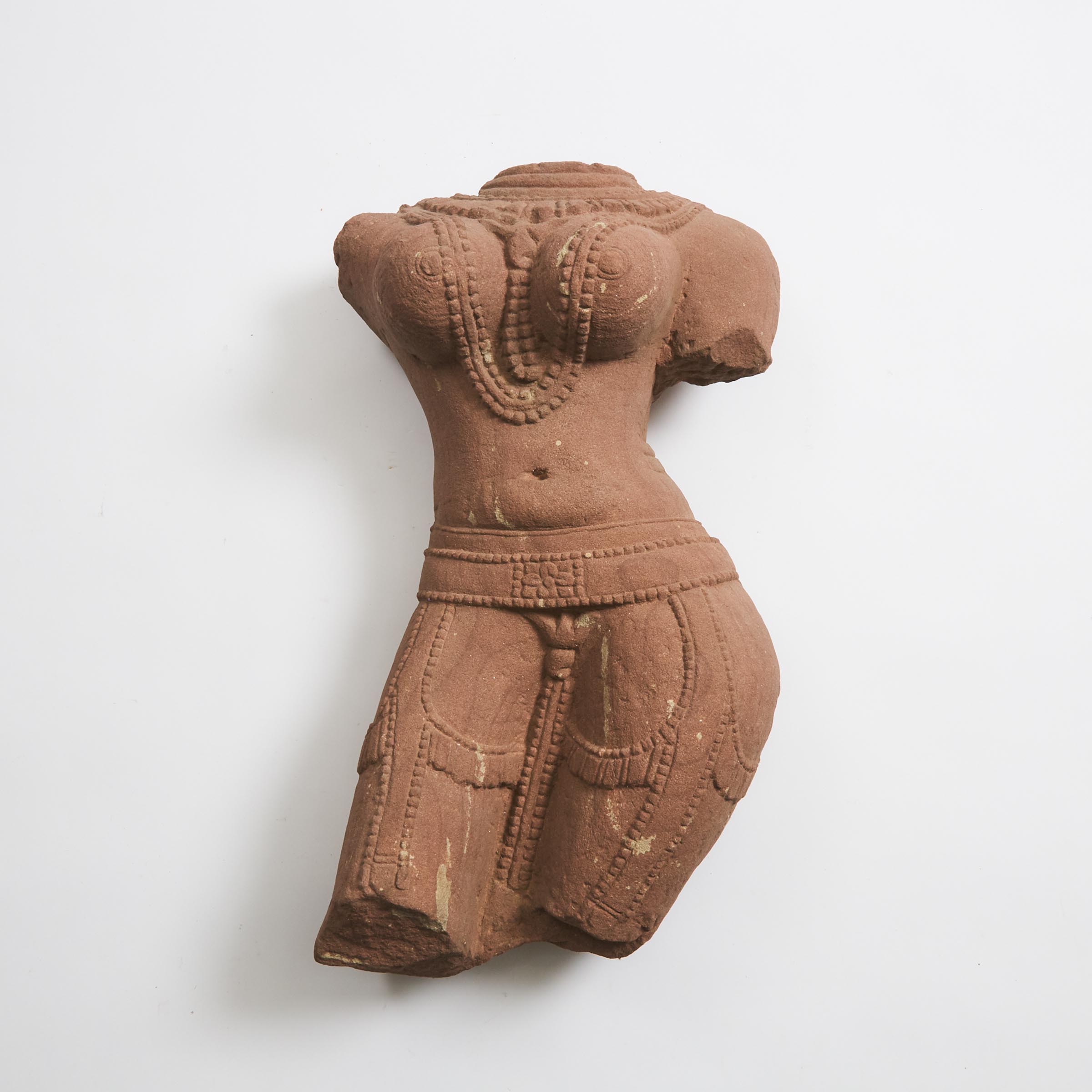 A Red Sandstone Torso of a Female Deity, India, 12th Century or Later